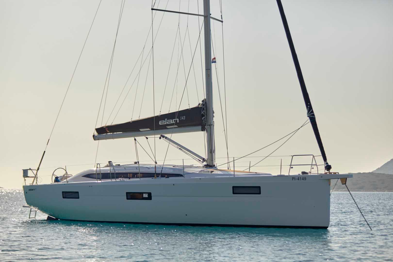 Elan-Impression 43 2024-Hard Loaded CT-US-2024 Elan Impression 43 sailboat on calm waters.-9178291 | Thumbnail