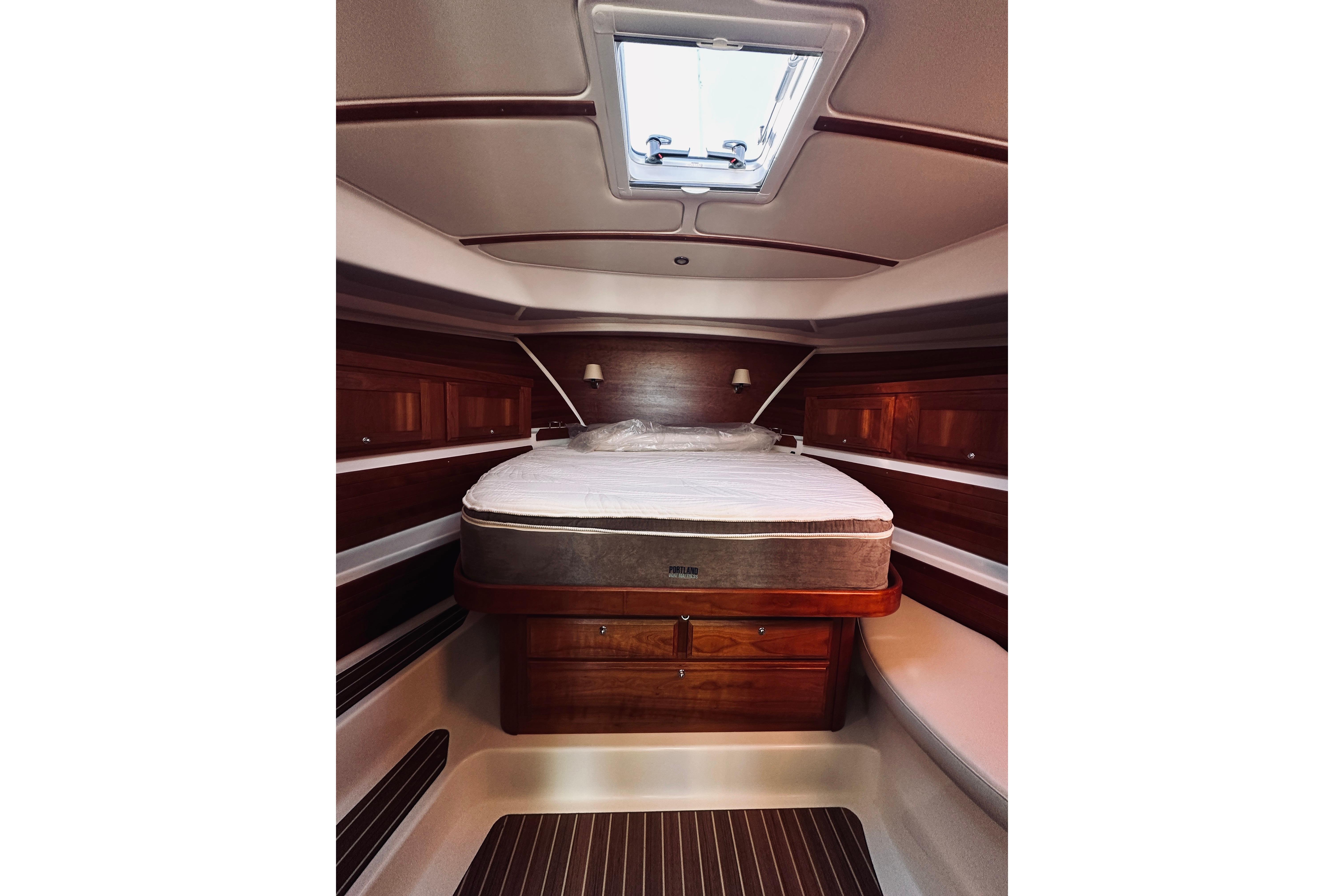 Luxurious cabin interior of 2021 Back Cove 37 yacht with elegant wood finish.