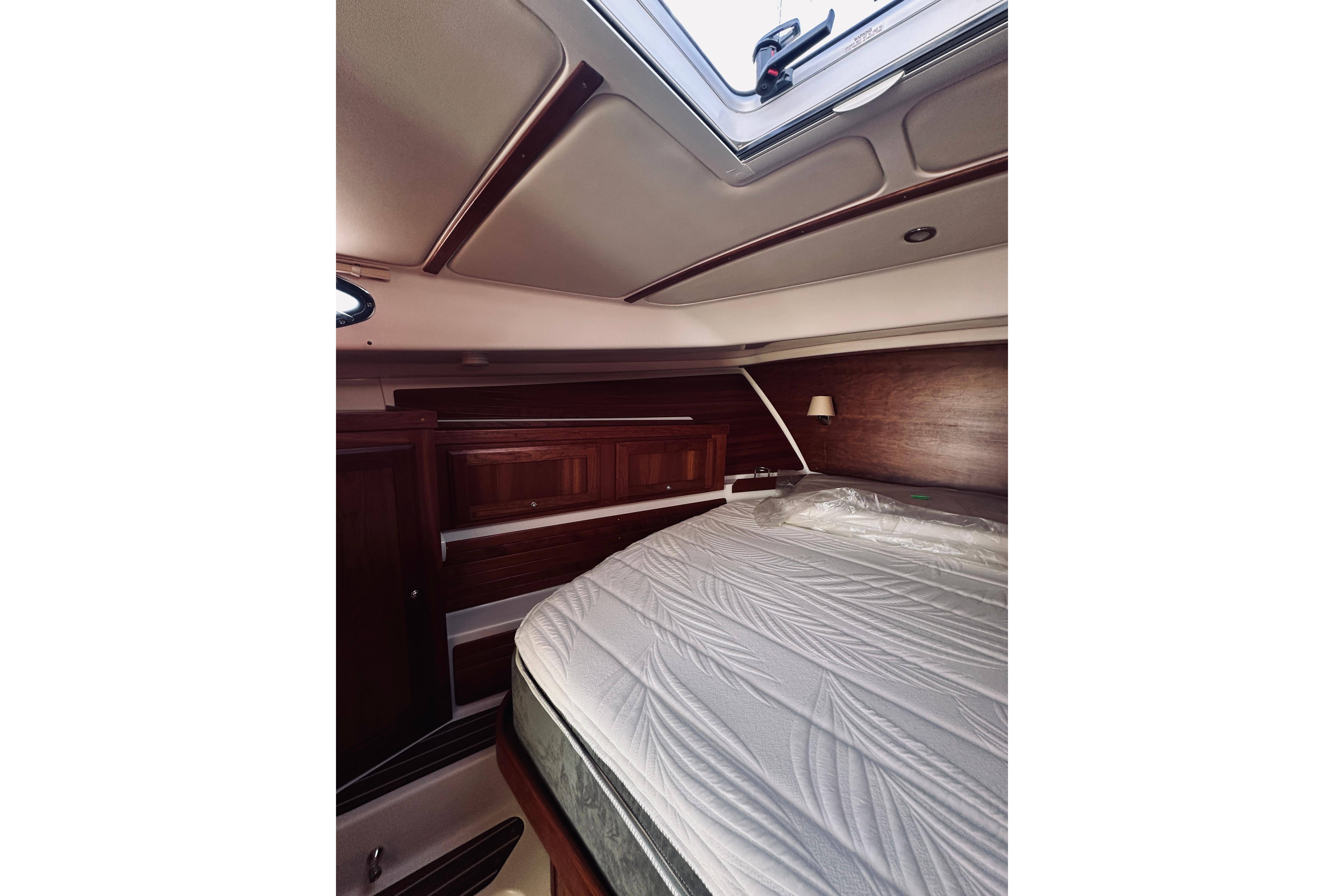 Luxurious cabin interior of 2021 Back Cove 37 yacht with elegant wood finish.