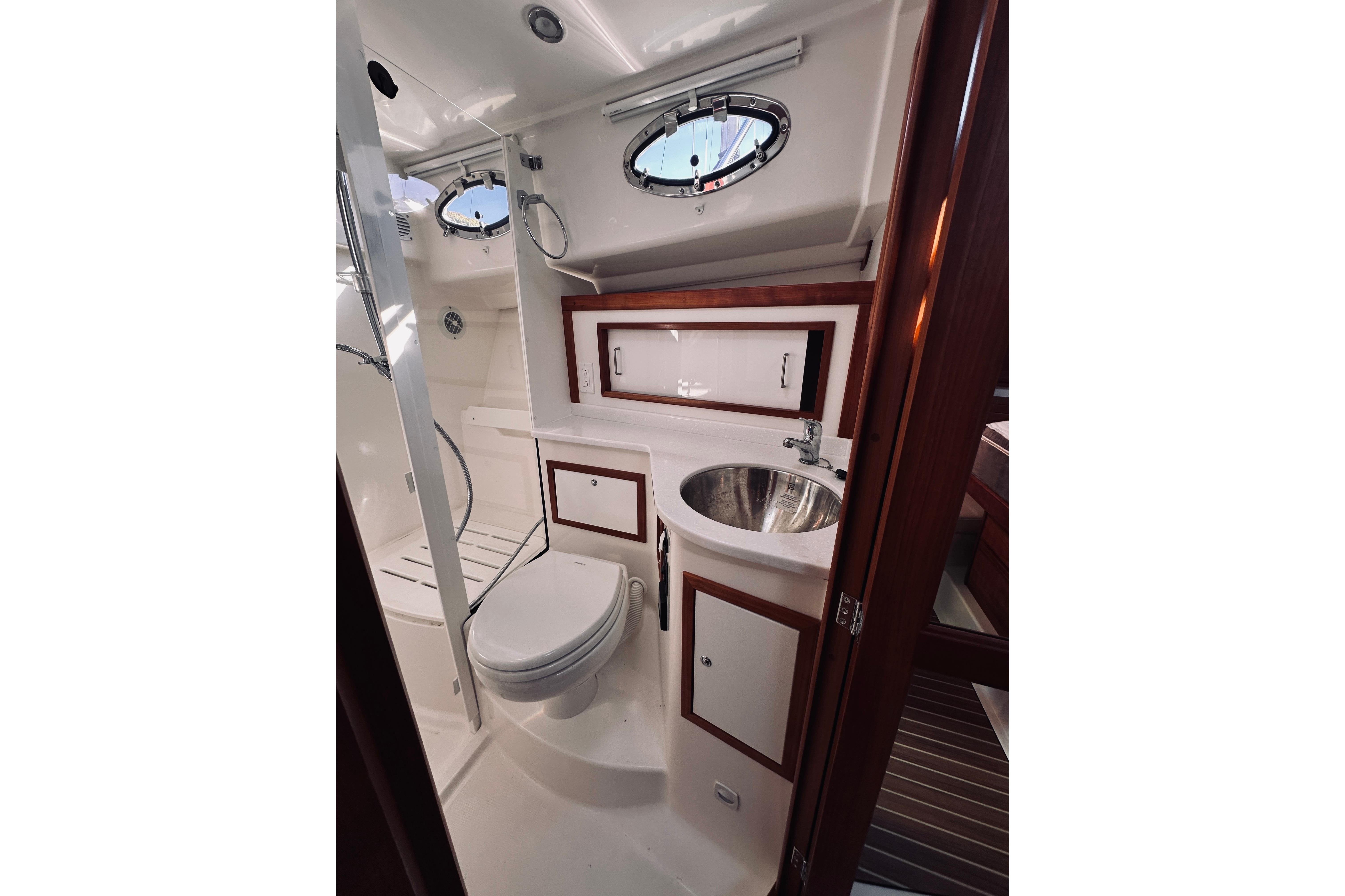 Luxurious bathroom in 2021 Back Cove 37 yacht with modern fixtures and elegant design.