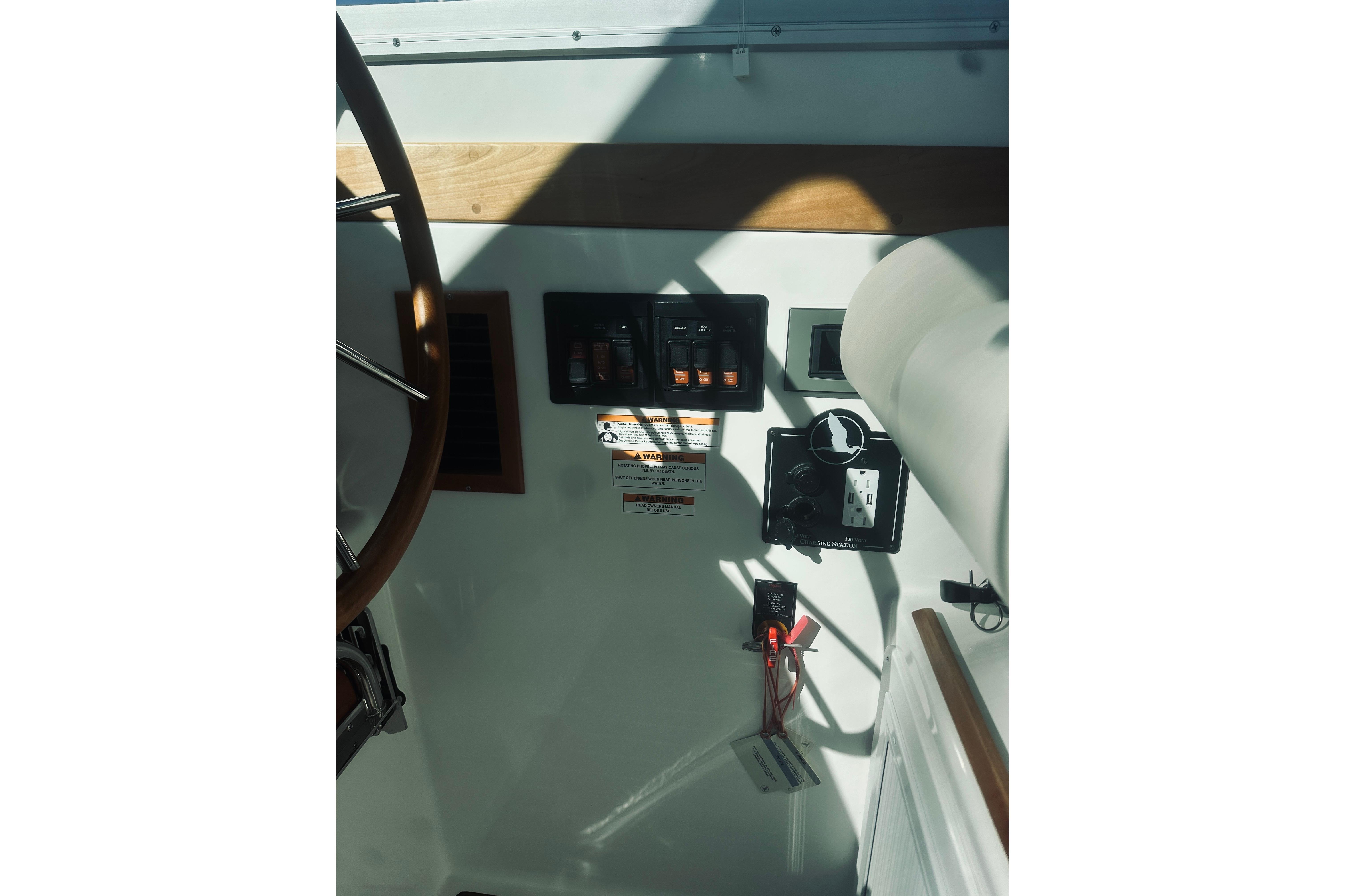 2021 Back Cove 37 boat dashboard with control panel and steering wheel.