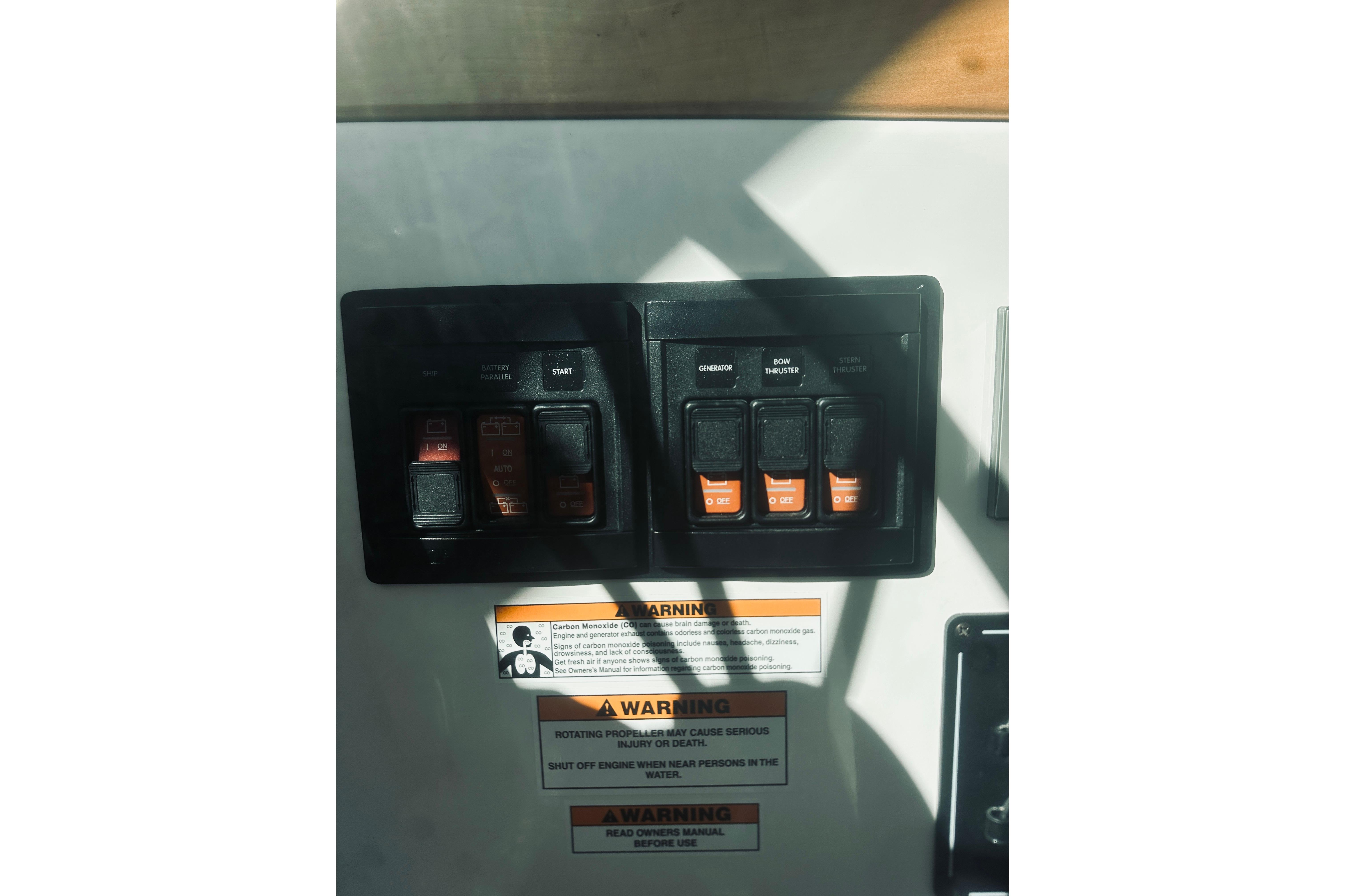 Control panel of a 2021 Back Cove 37 boat with warning labels.