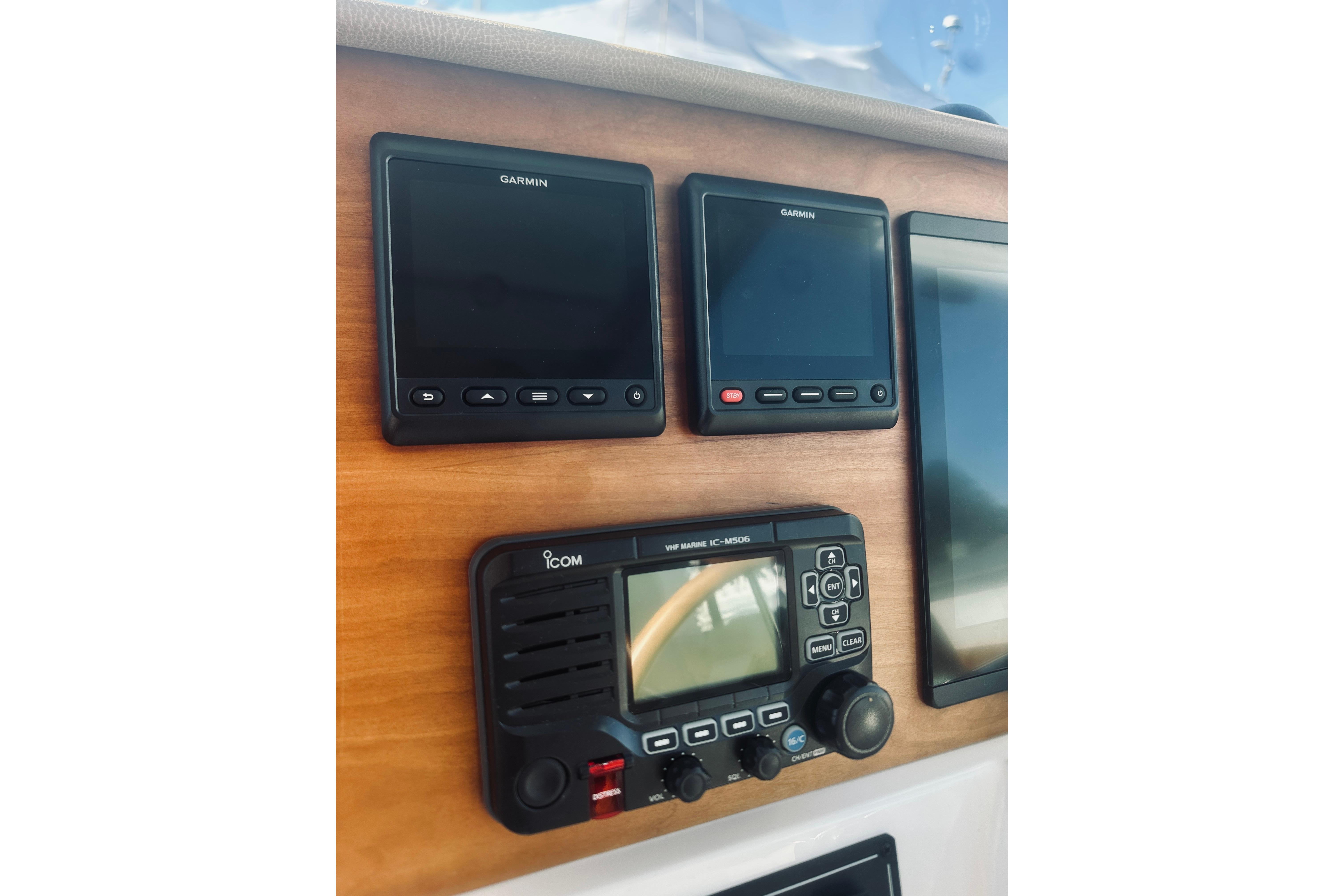 Control panel of 2021 Back Cove 37 with Garmin and Icom marine electronics.
