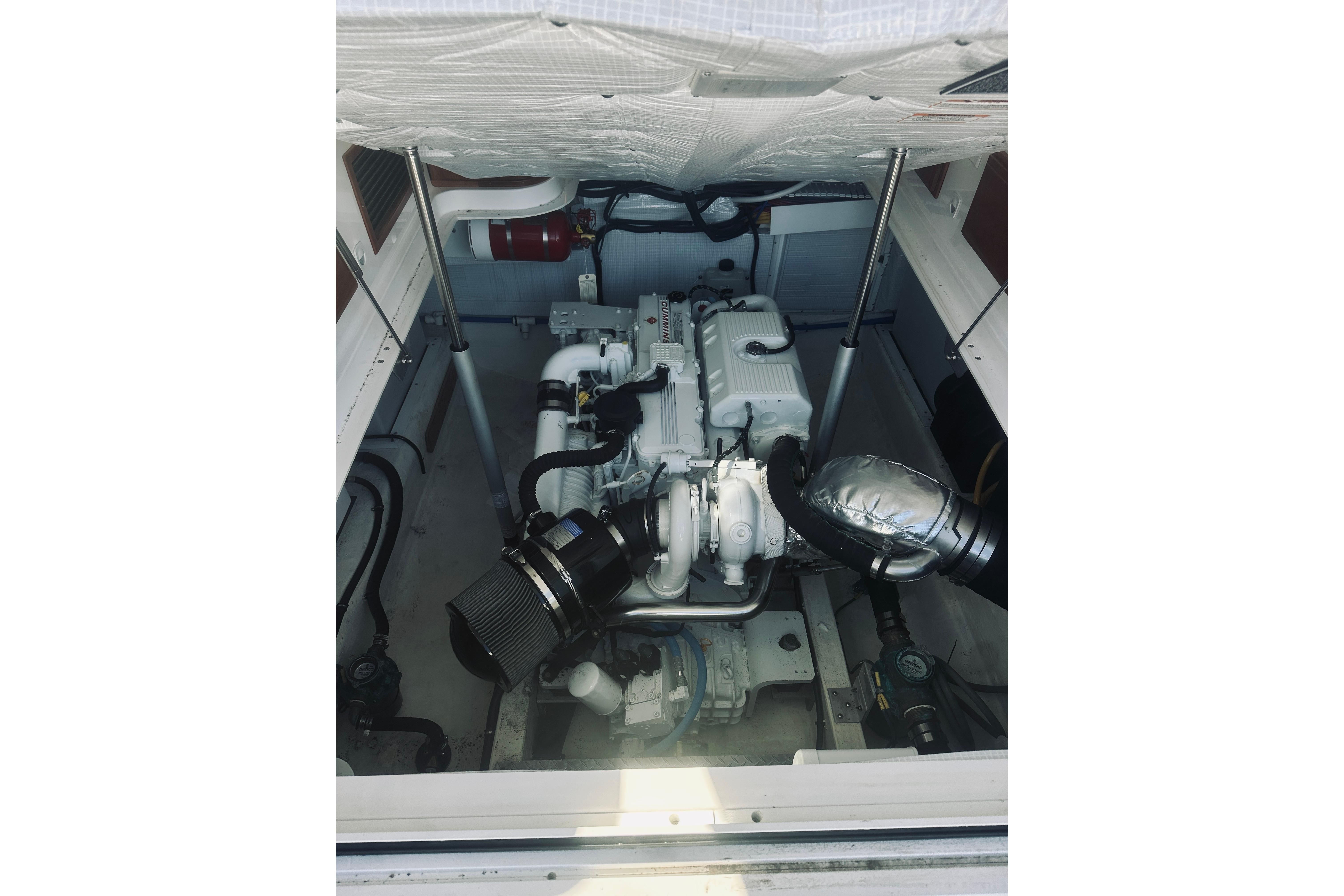 Engine compartment of a 2021 Back Cove 37 boat, showcasing mechanical components.