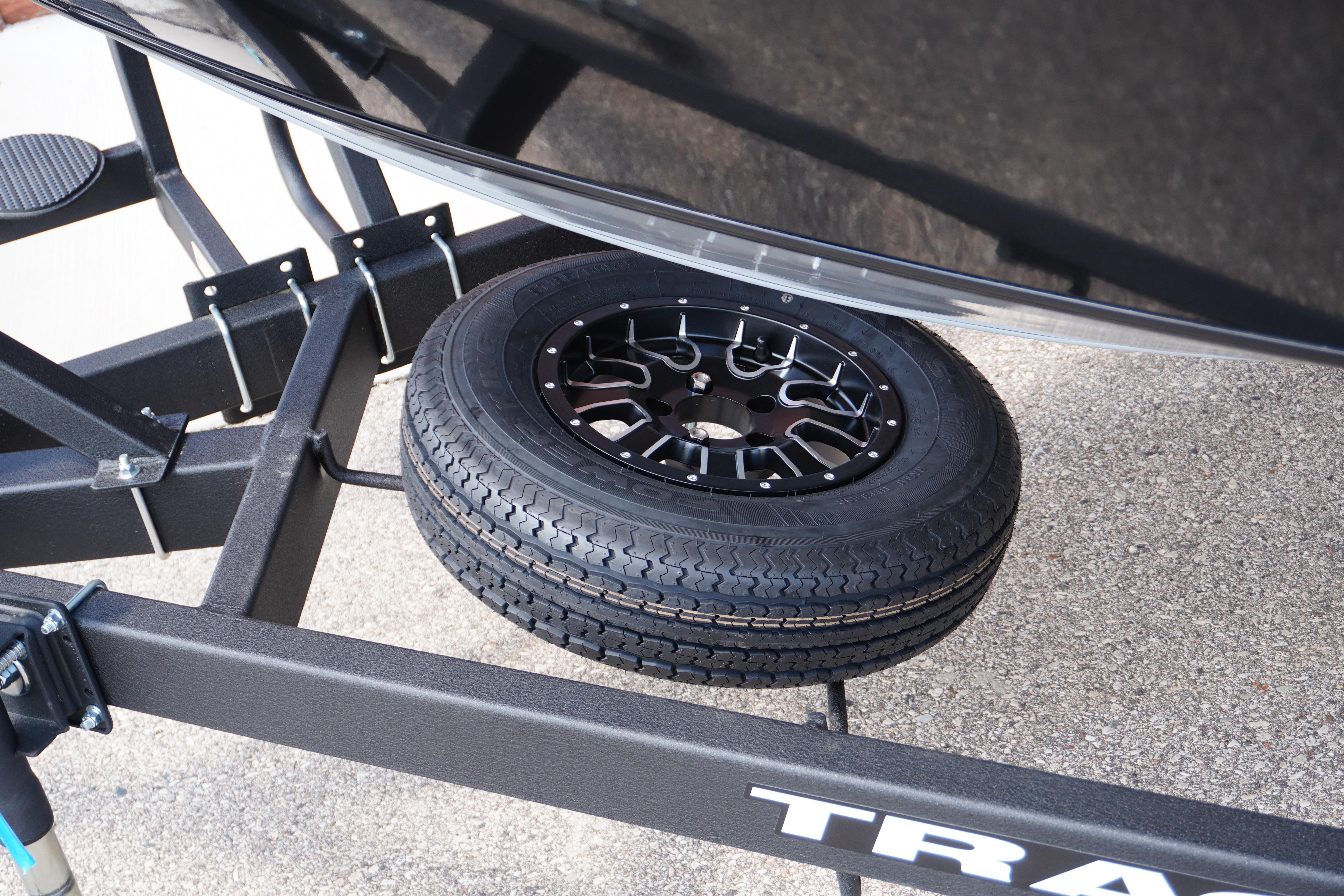 2026 Tracker Targa V-18 WT trailer with spare tire mounted underneath.