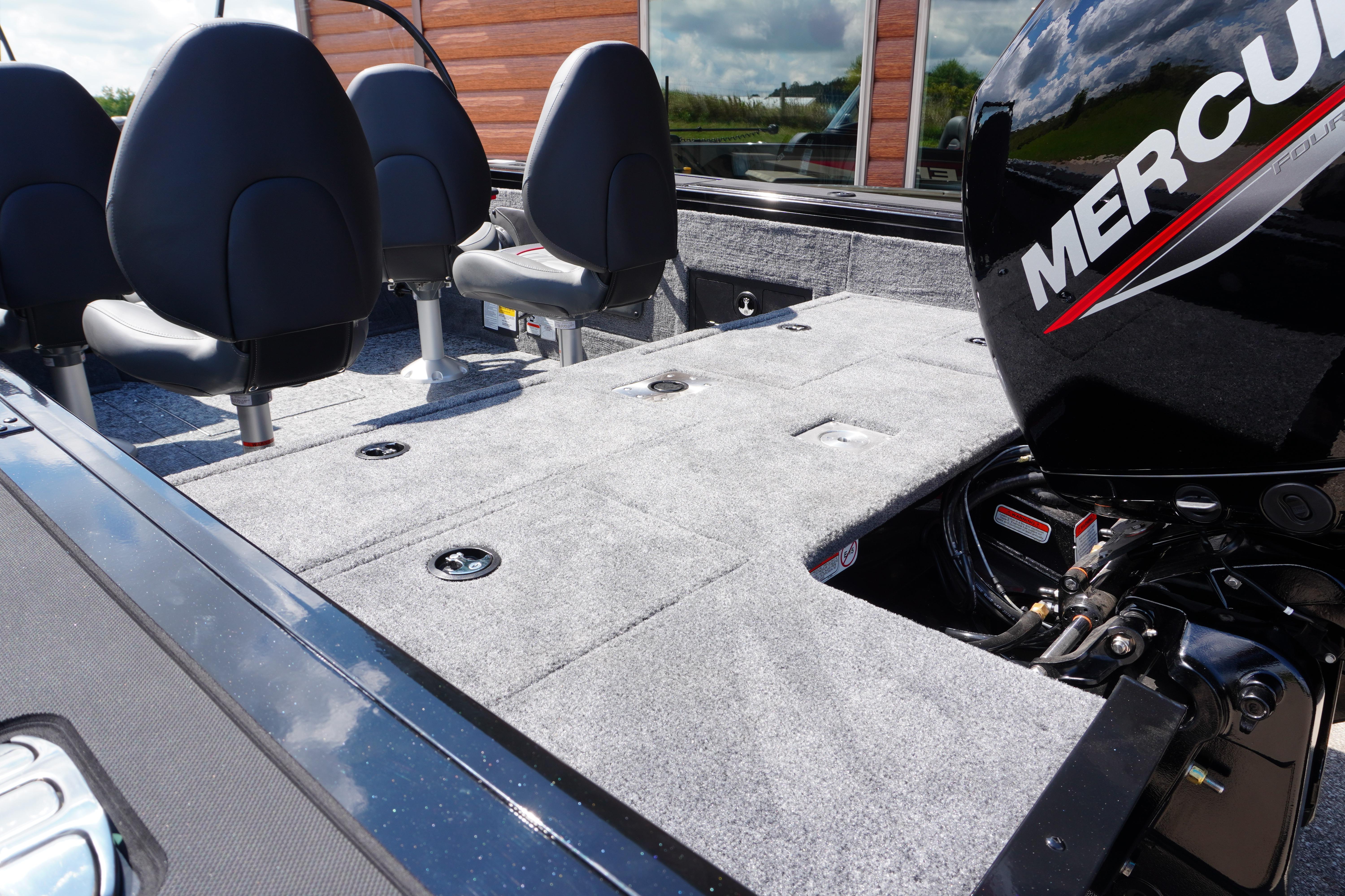 2026 Tracker Targa V-18 WT boat interior with Mercury engine, featuring seating and storage.