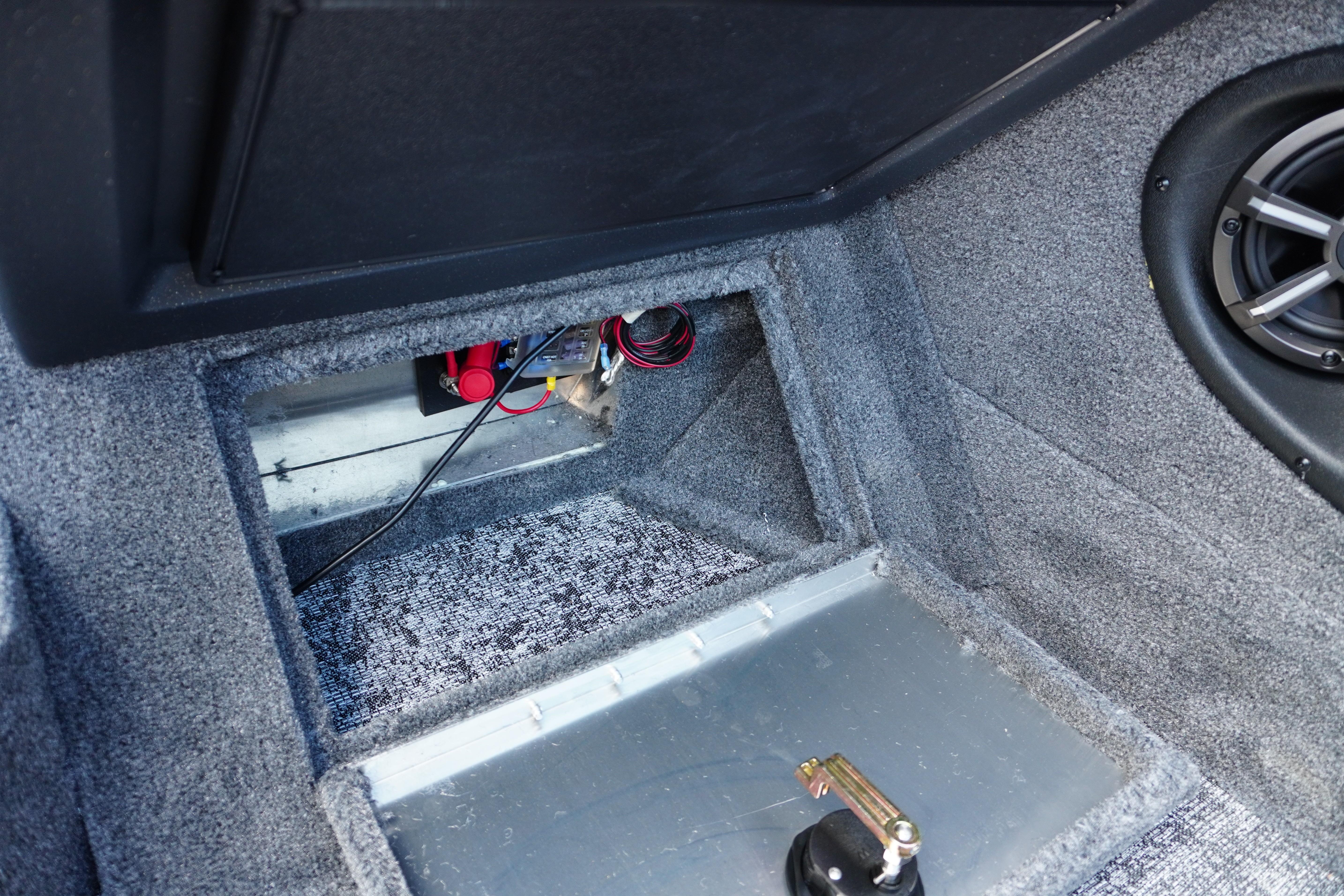 Interior view of 2026 Tracker Targa V-18 WT boat, showcasing wiring and speaker setup.
