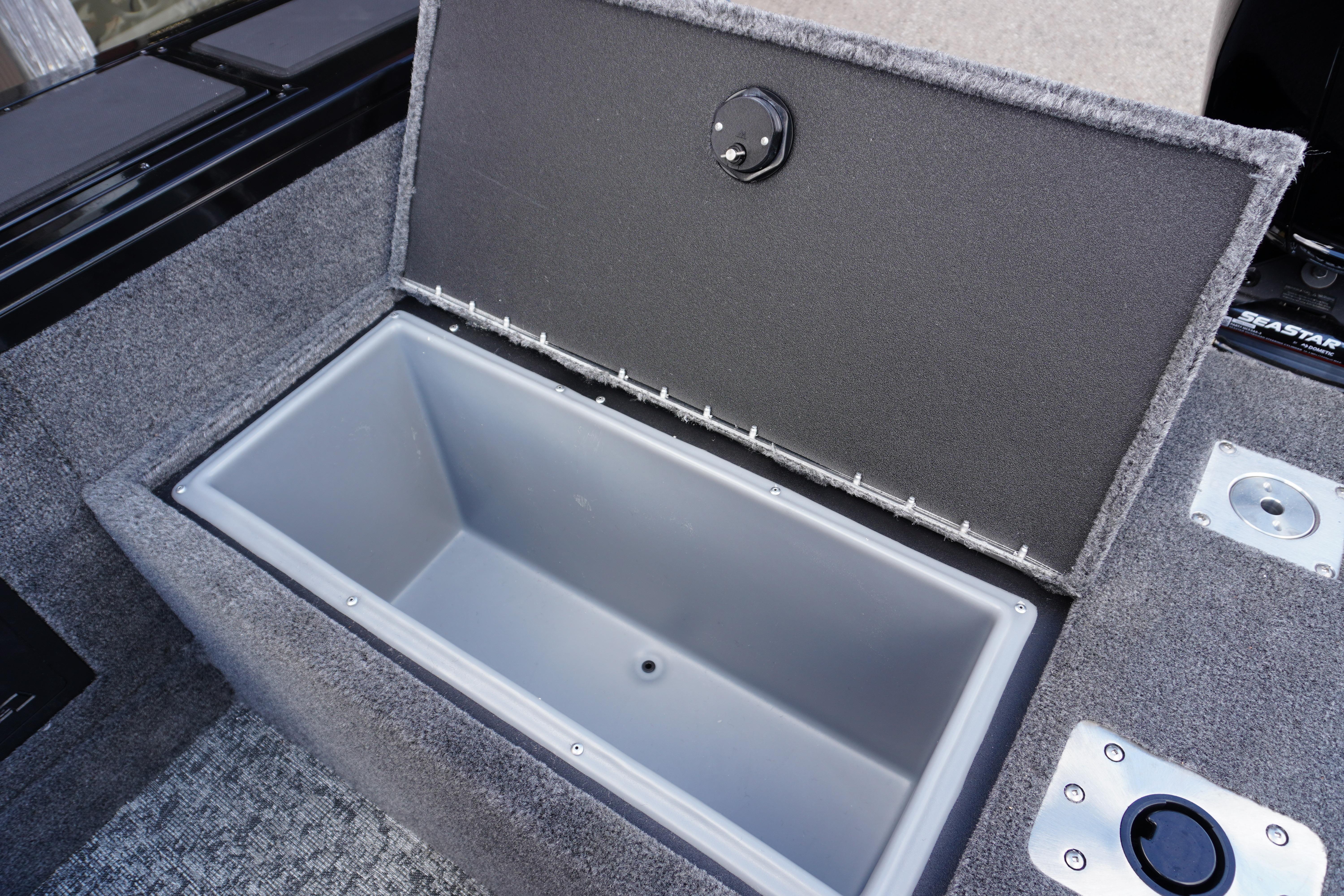 2026 Tracker Targa V-18 WT boat storage compartment with open lid, showcasing interior space.