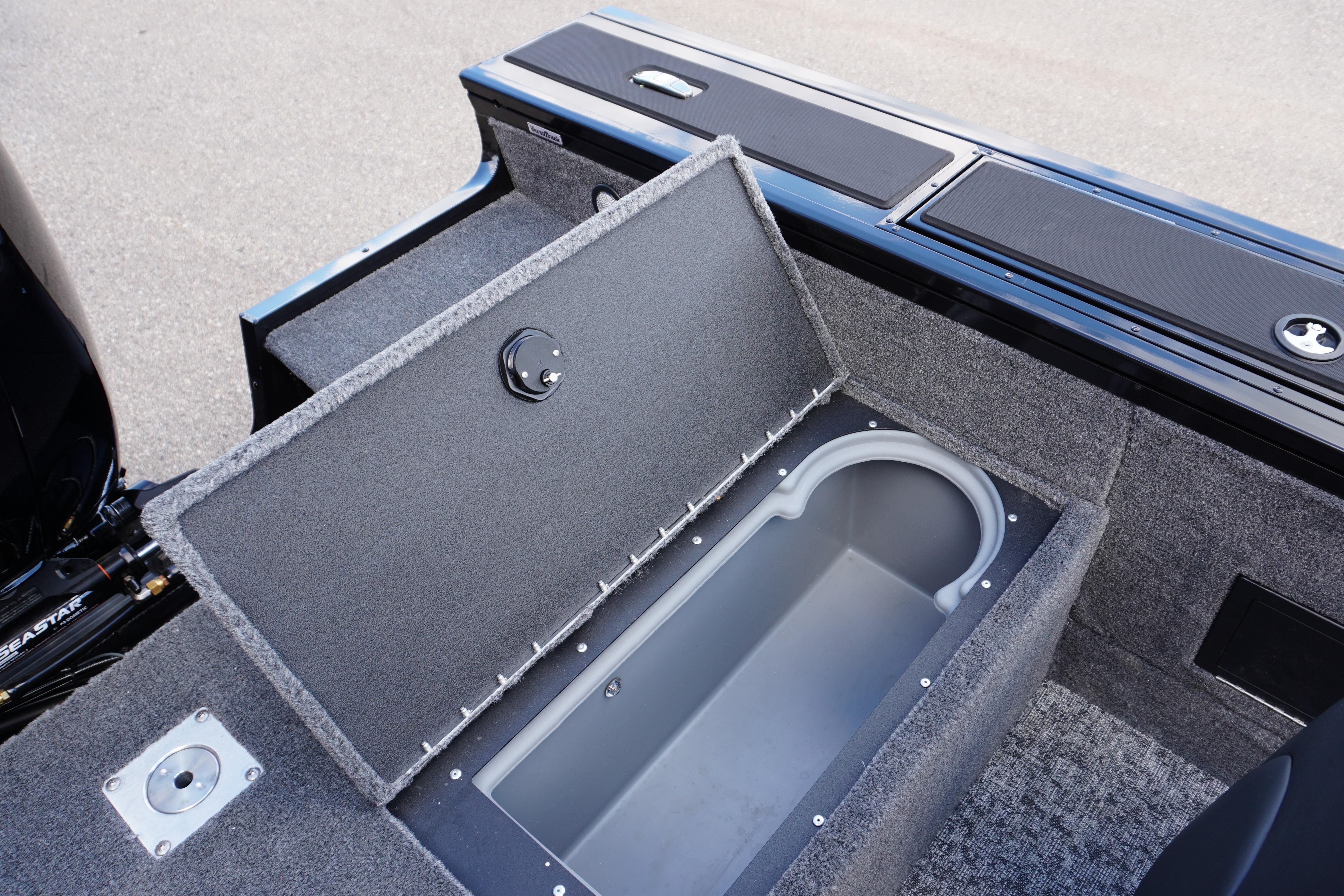 2026 Tracker Targa V-18 WT boat with open storage compartment.
