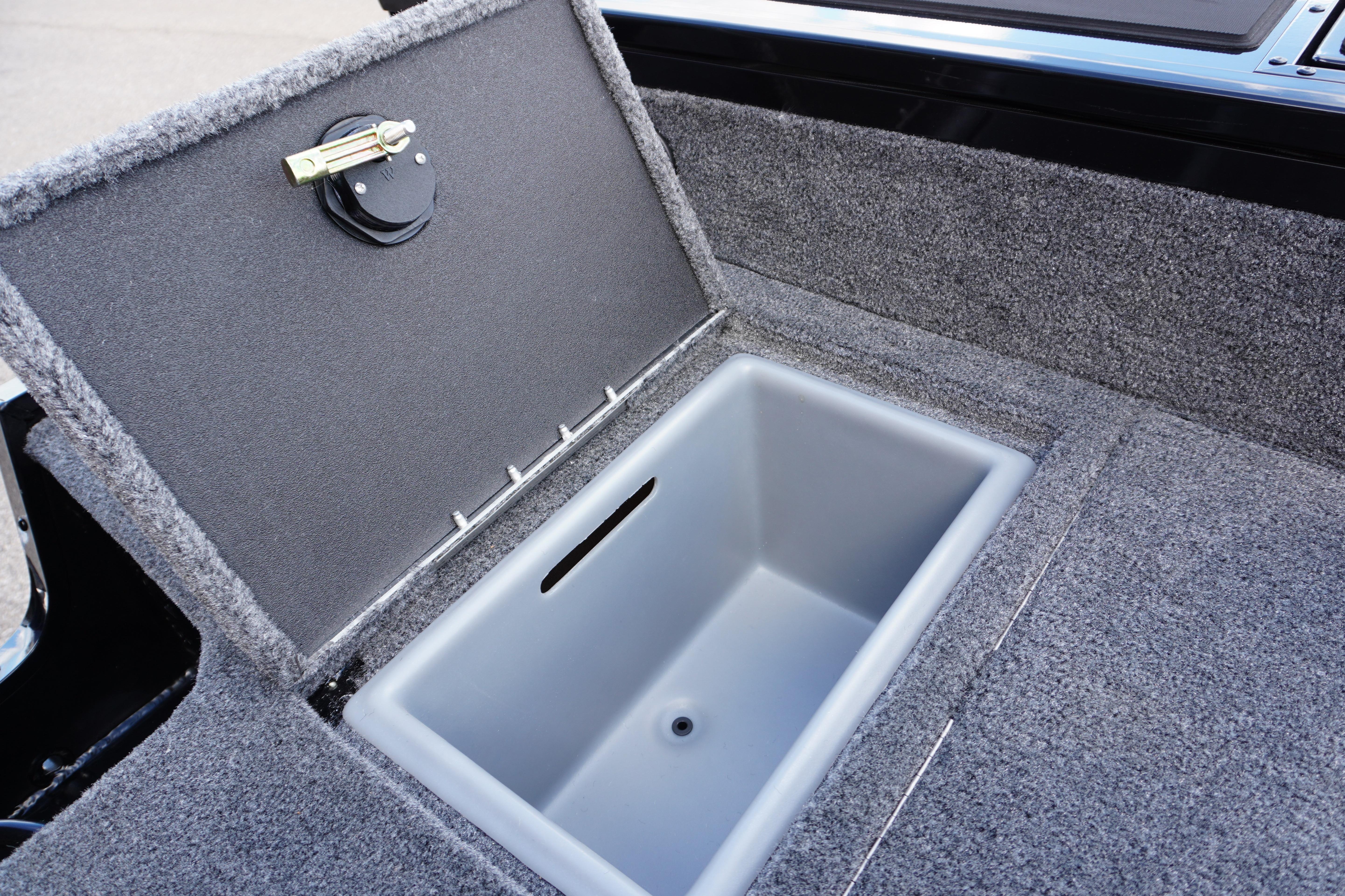 2026 Tracker Targa V-18 WT boat storage compartment with open lid, gray interior.