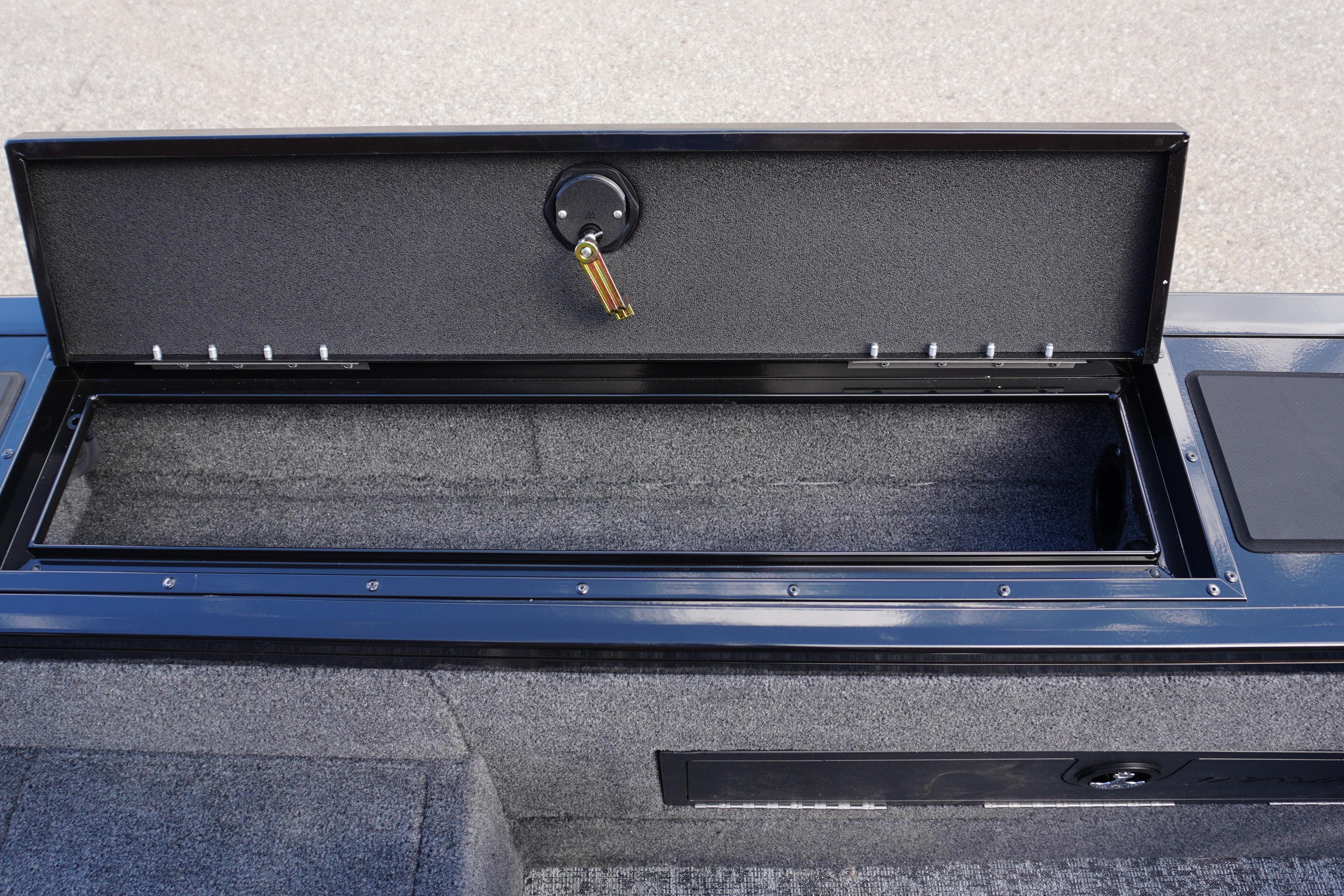 Open storage compartment in 2026 Tracker Targa V-18 WT boat, showcasing interior space.