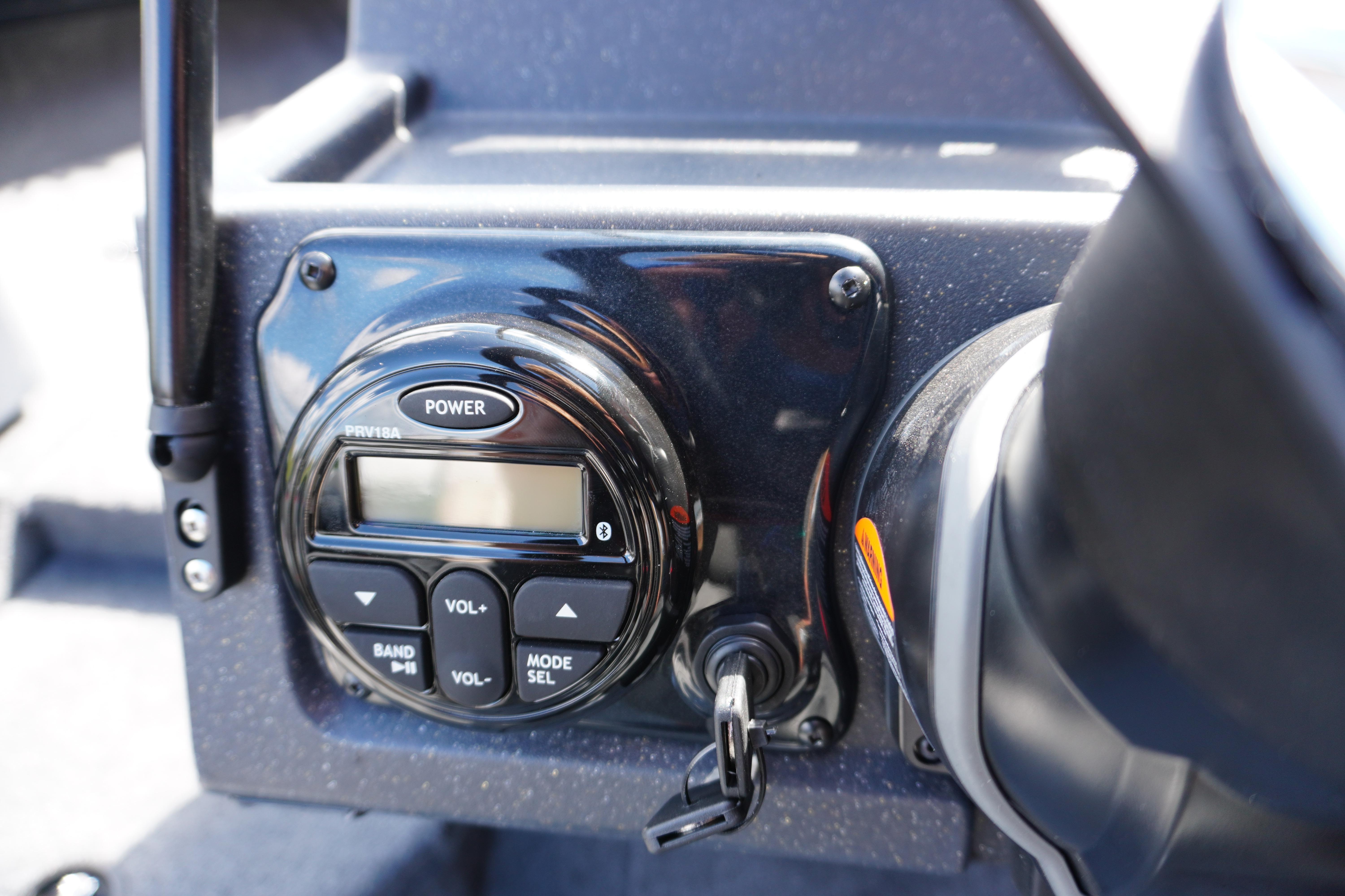 Control panel of 2026 Tracker Targa V-18 WT boat with power and volume buttons.