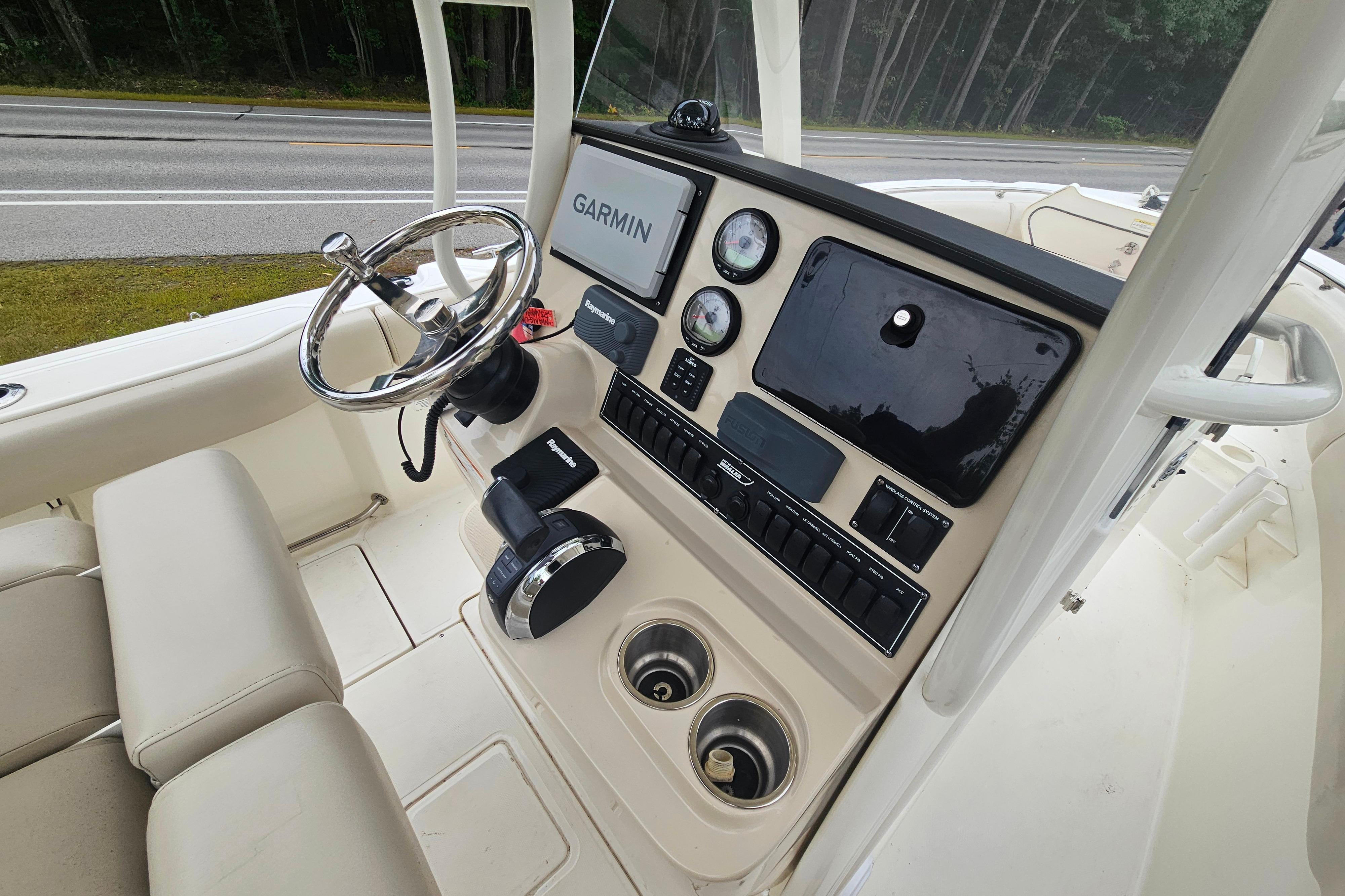 2019 Boston Whaler 230 Outrage boat dashboard with Garmin navigation system and controls.