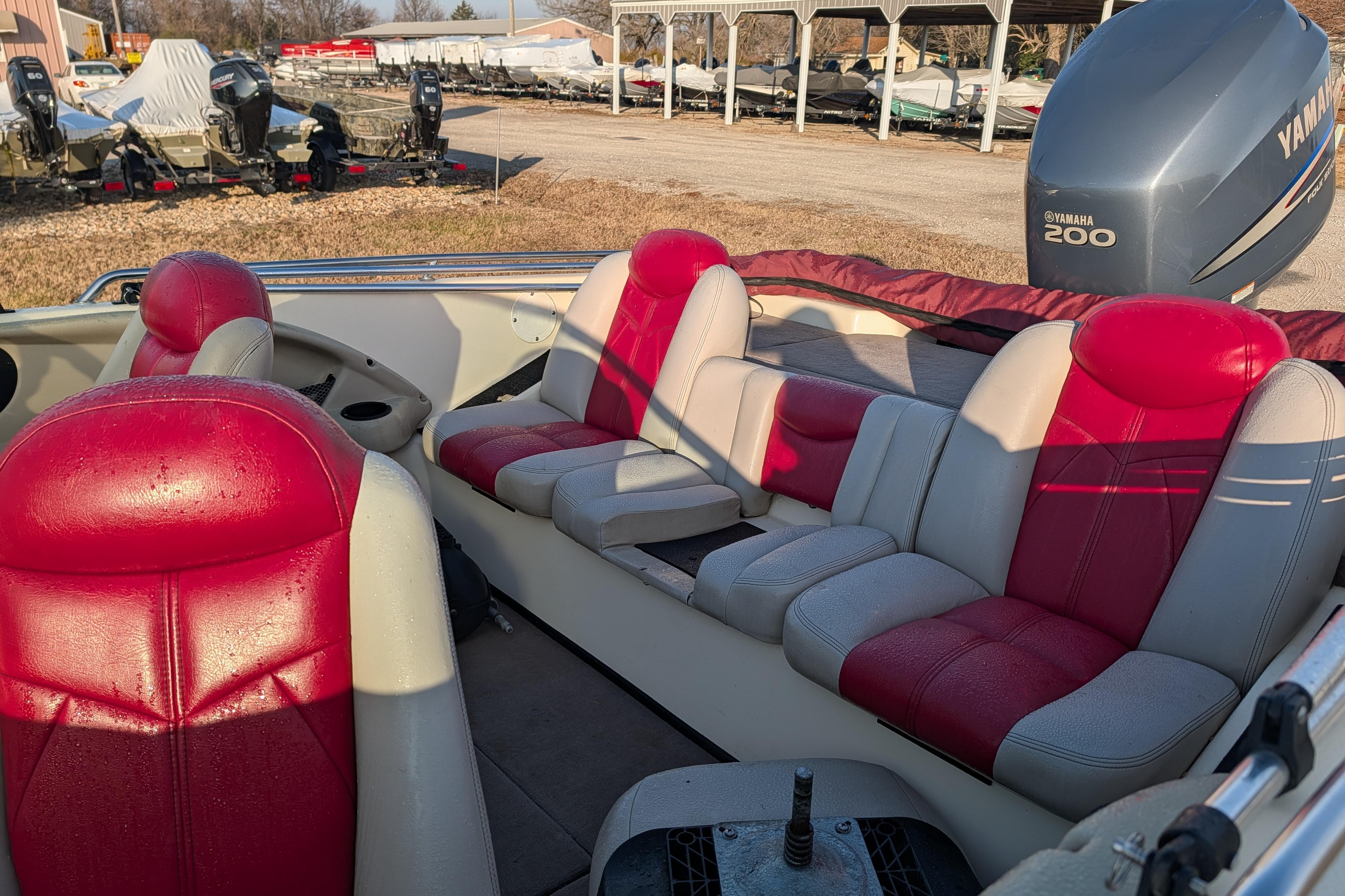 2009 Skeeter SL1900 boat interior with red and white seats, Yamaha 200 engine visible.