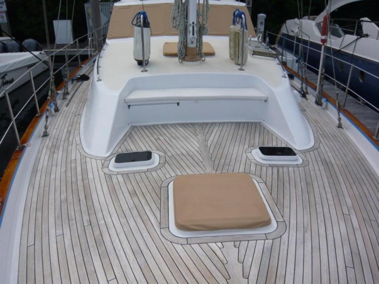 Cheoy Lee-Sloop 1990-Maraya FL-US-1990 Cheoy Lee Sloop deck with teak flooring and white cabin details.-9808426 | Thumbnail
