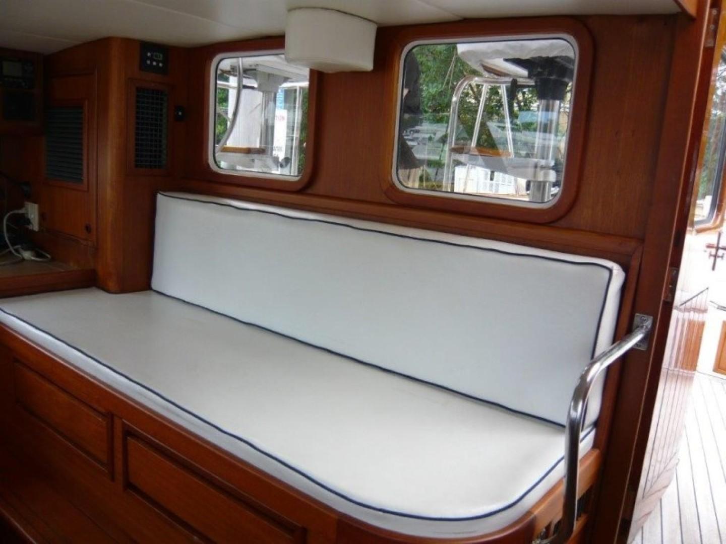 Cheoy Lee-Sloop 1990-Maraya FL-US-Interior of 1990 Cheoy Lee Sloop with white cushioned seating and wooden finish.-9808426 | Thumbnail