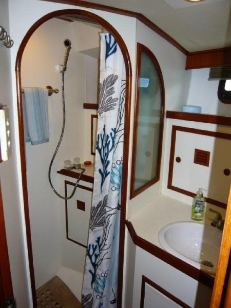 Cheoy Lee-Sloop 1990-Maraya FL-US-1990 Cheoy Lee Sloop bathroom with shower, sink, and nautical-themed decor.-9808426 | Thumbnail