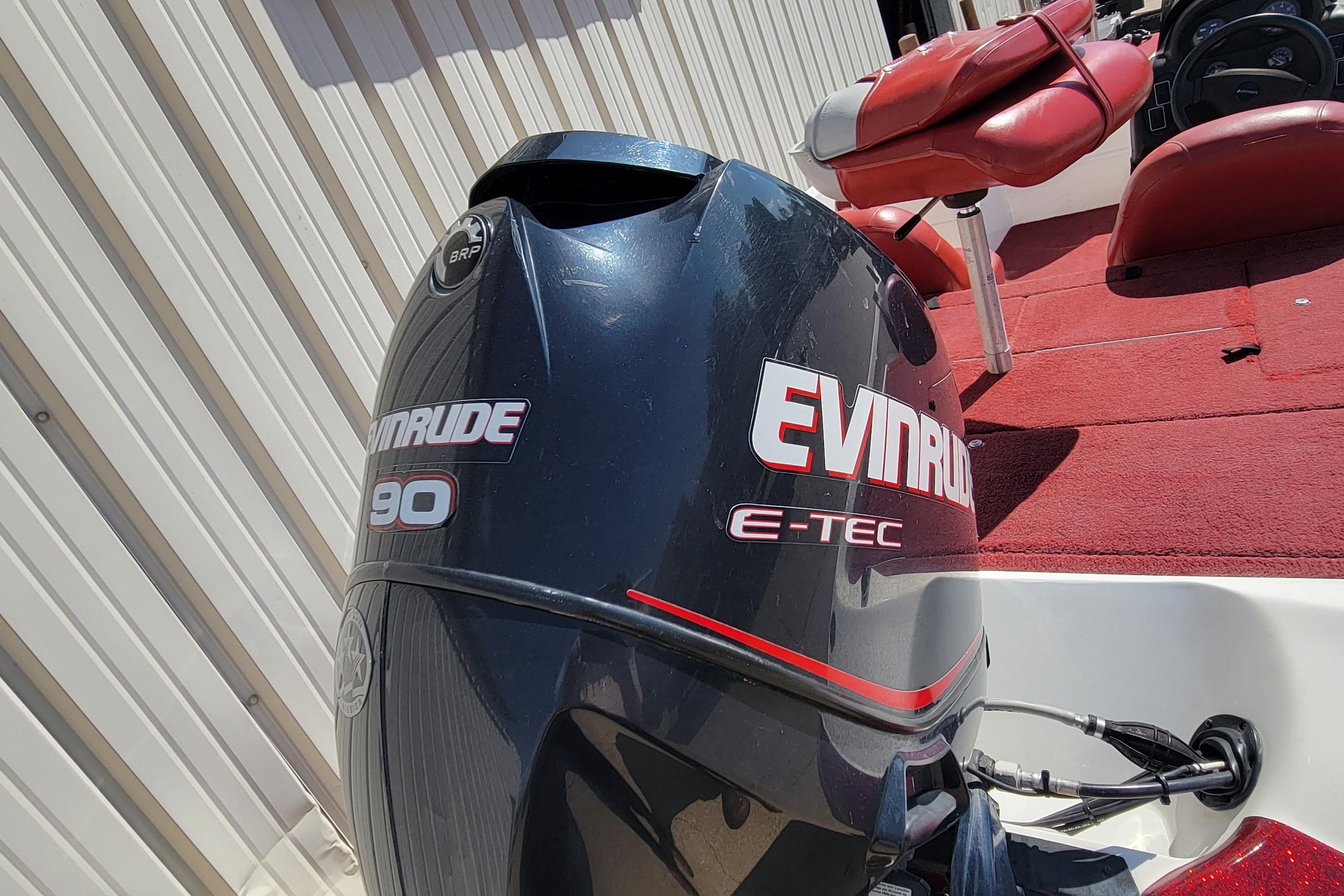 Evinrude E-TEC 90 outboard motor on 2000 Nitro 640LX boat, red interior.
