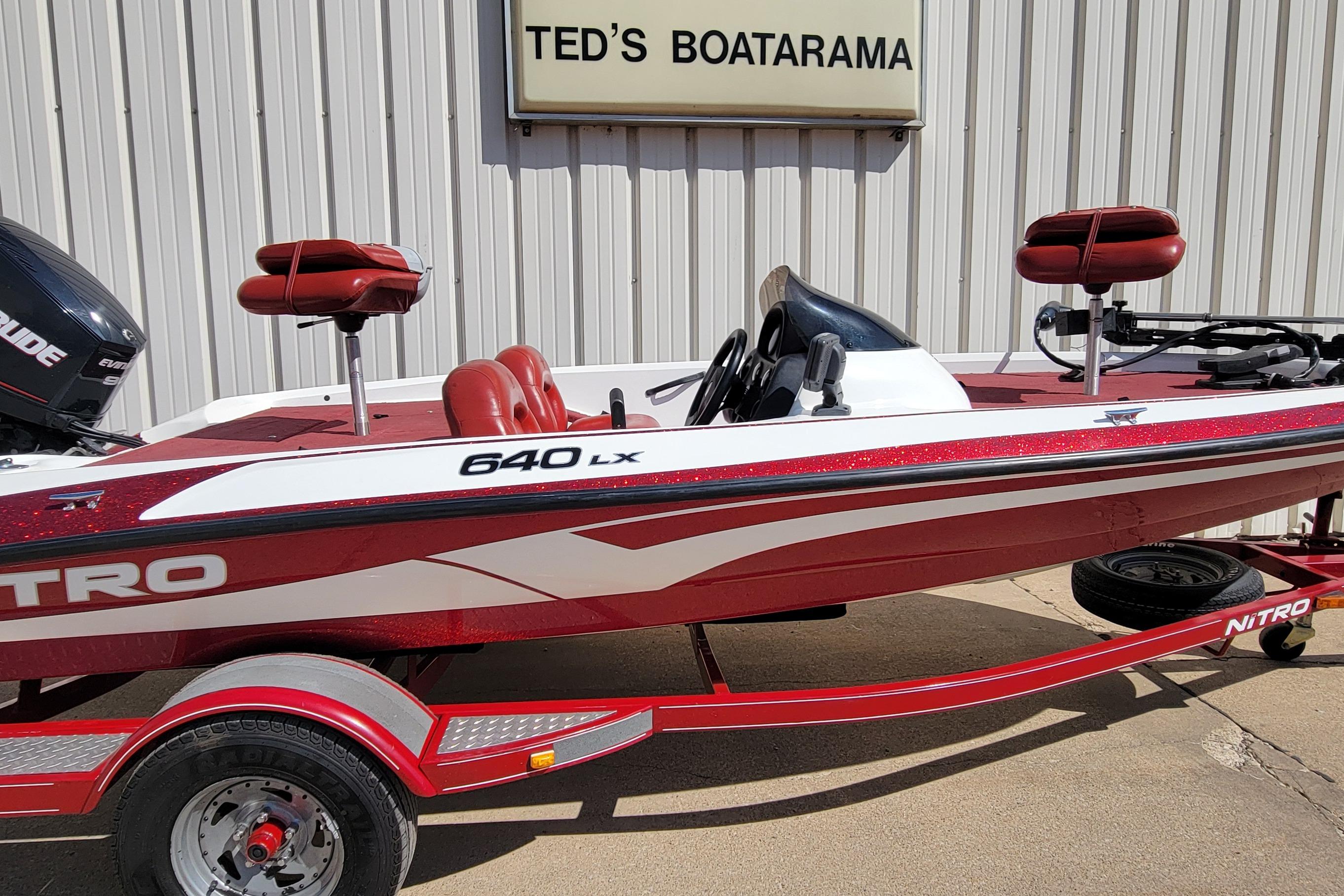 Red and white 2000 Nitro 640LX boat at Ted's Boatarama dealership.