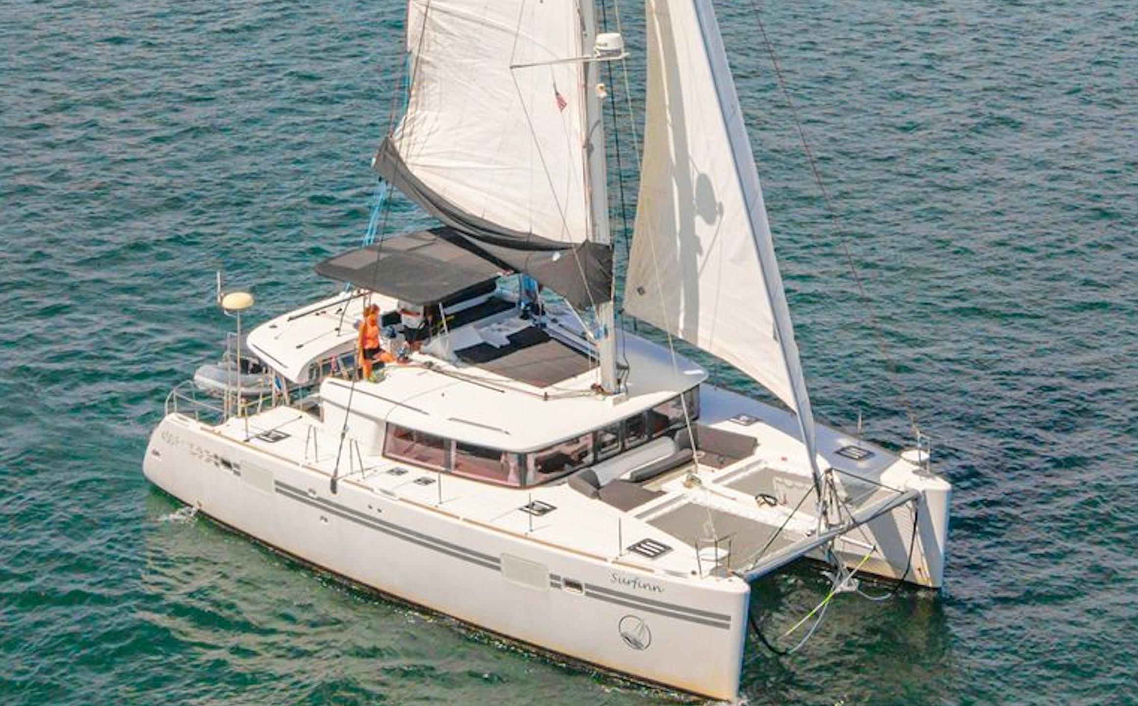Picture of Cruisin Cajun Lagoon 45.83 ft' 450 F 2017 Lagoon 450 F catamaran sailing on open water with full sails. 
