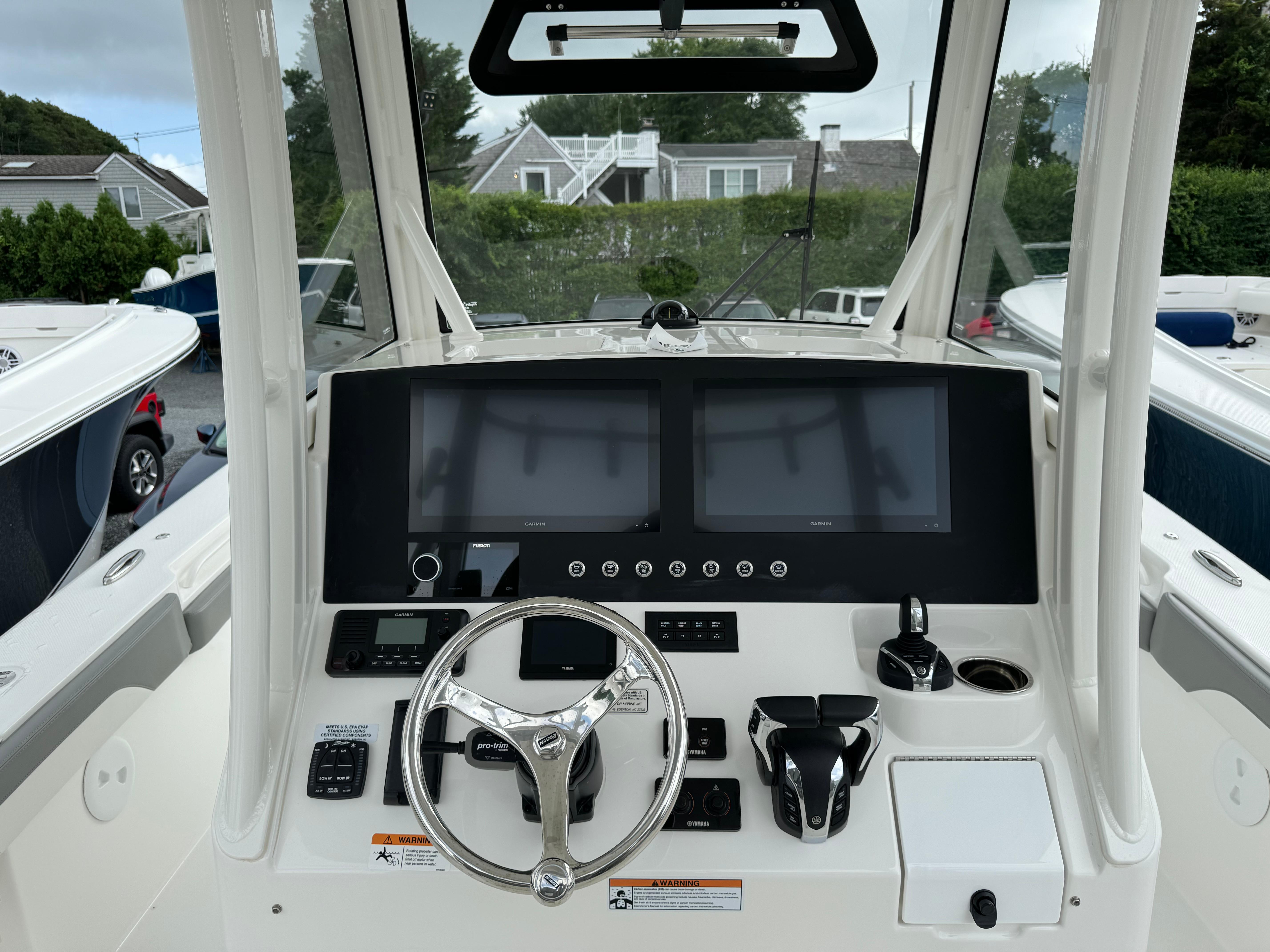 Regulator-30XO 2024-STORM GRAY MA-US-2024 Regulator 30XO boat dashboard with dual screens and steering wheel.-9692464 | Thumbnail