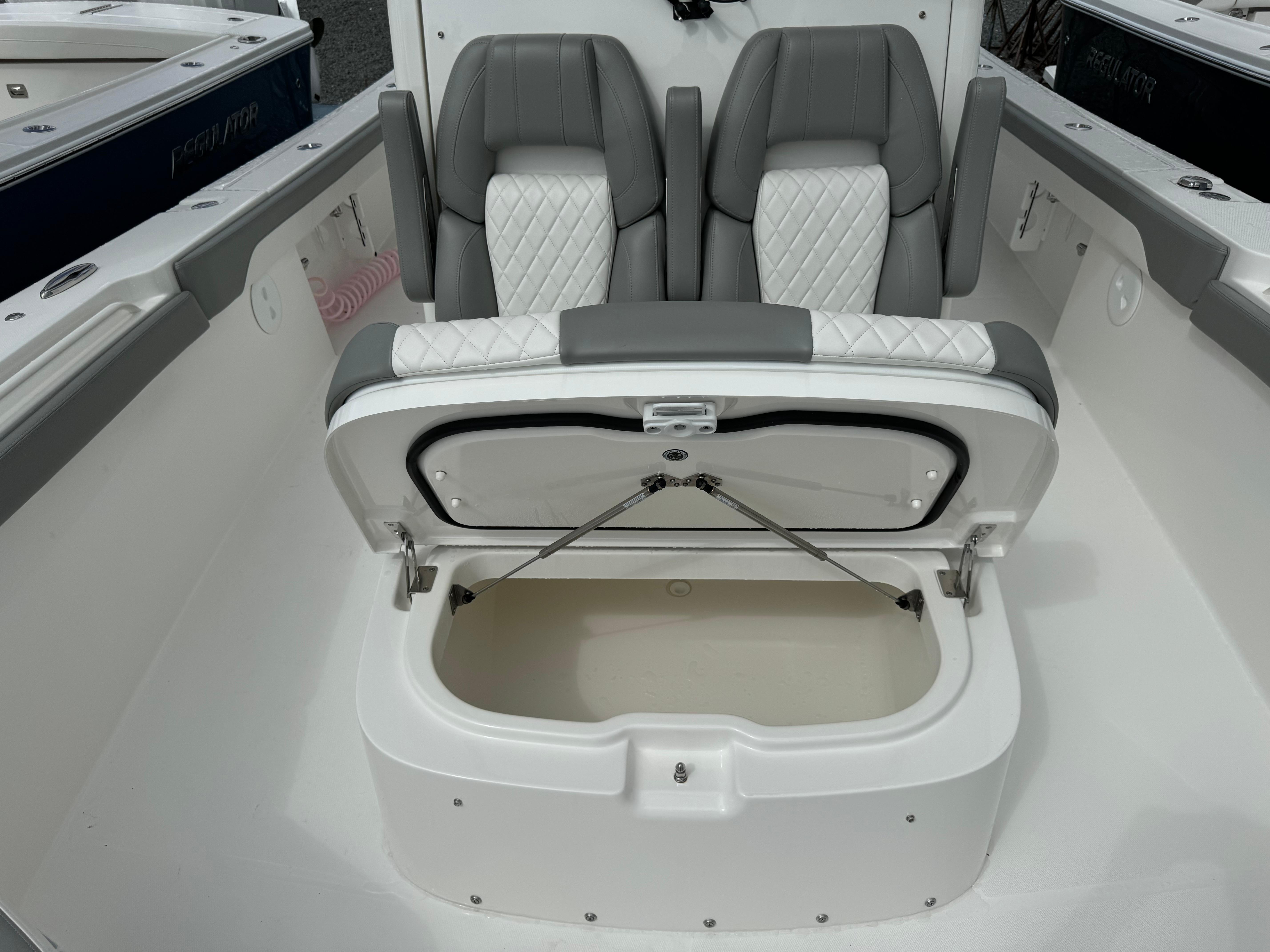 Regulator-30XO 2024-STORM GRAY MA-US-2024 Regulator 30XO boat seating with open storage compartment, featuring gray and white upholstery.-9692464 | Thumbnail