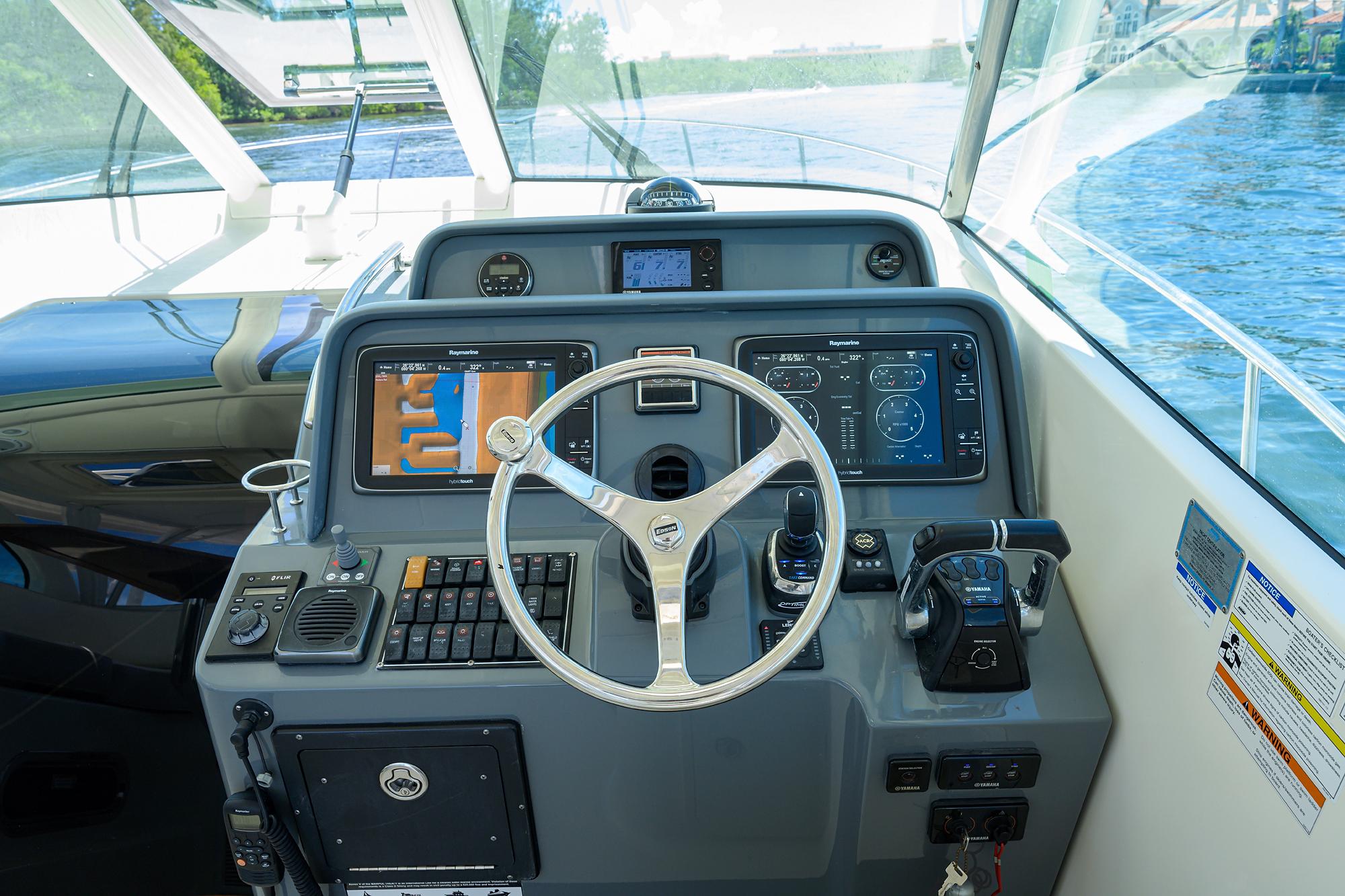 Pursuit 38 Nauti Buoy II - Helm steering and gauges