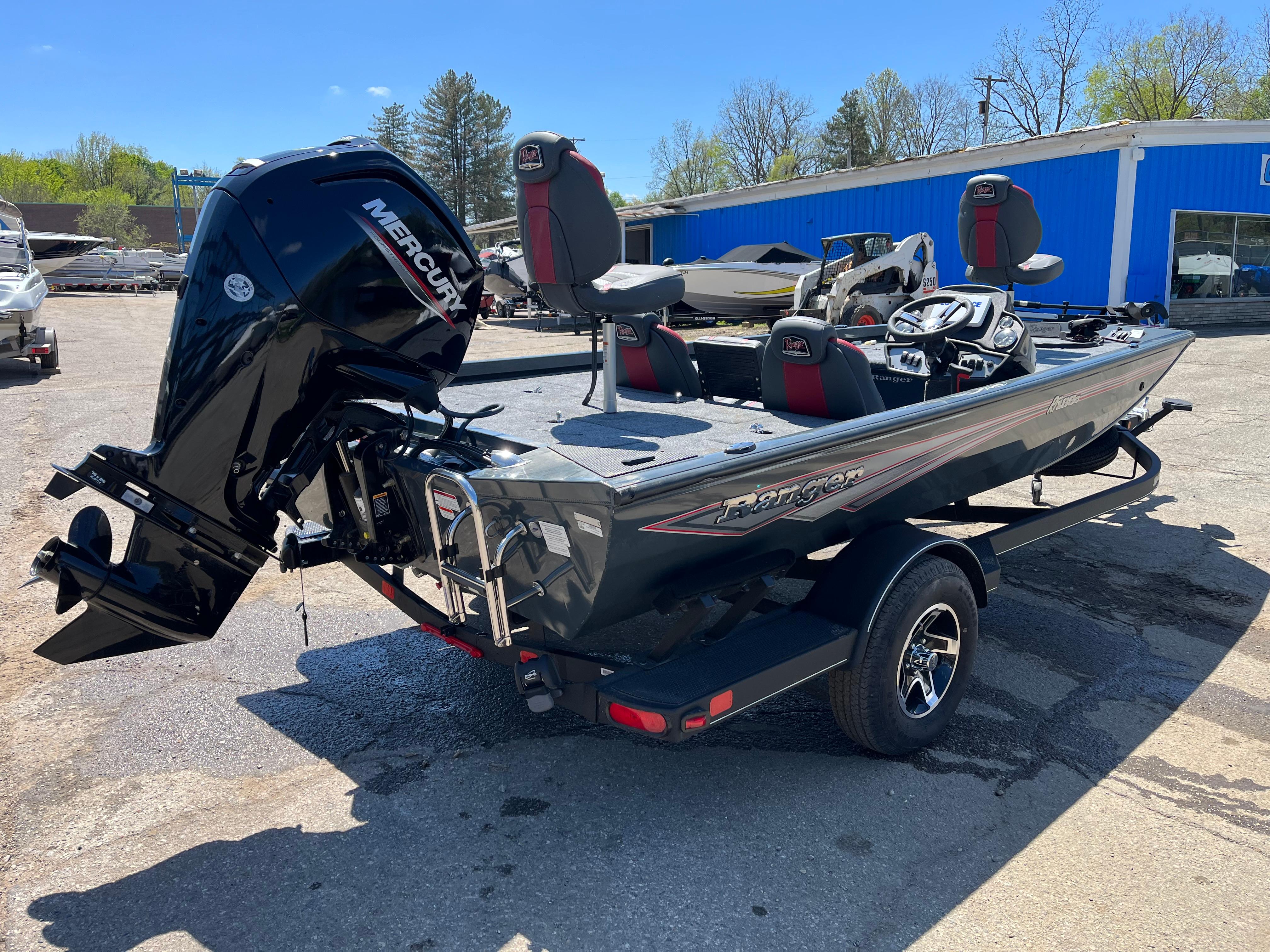 2024 Ranger RT188C boat with Mercury engine, parked outdoors on a sunny day.