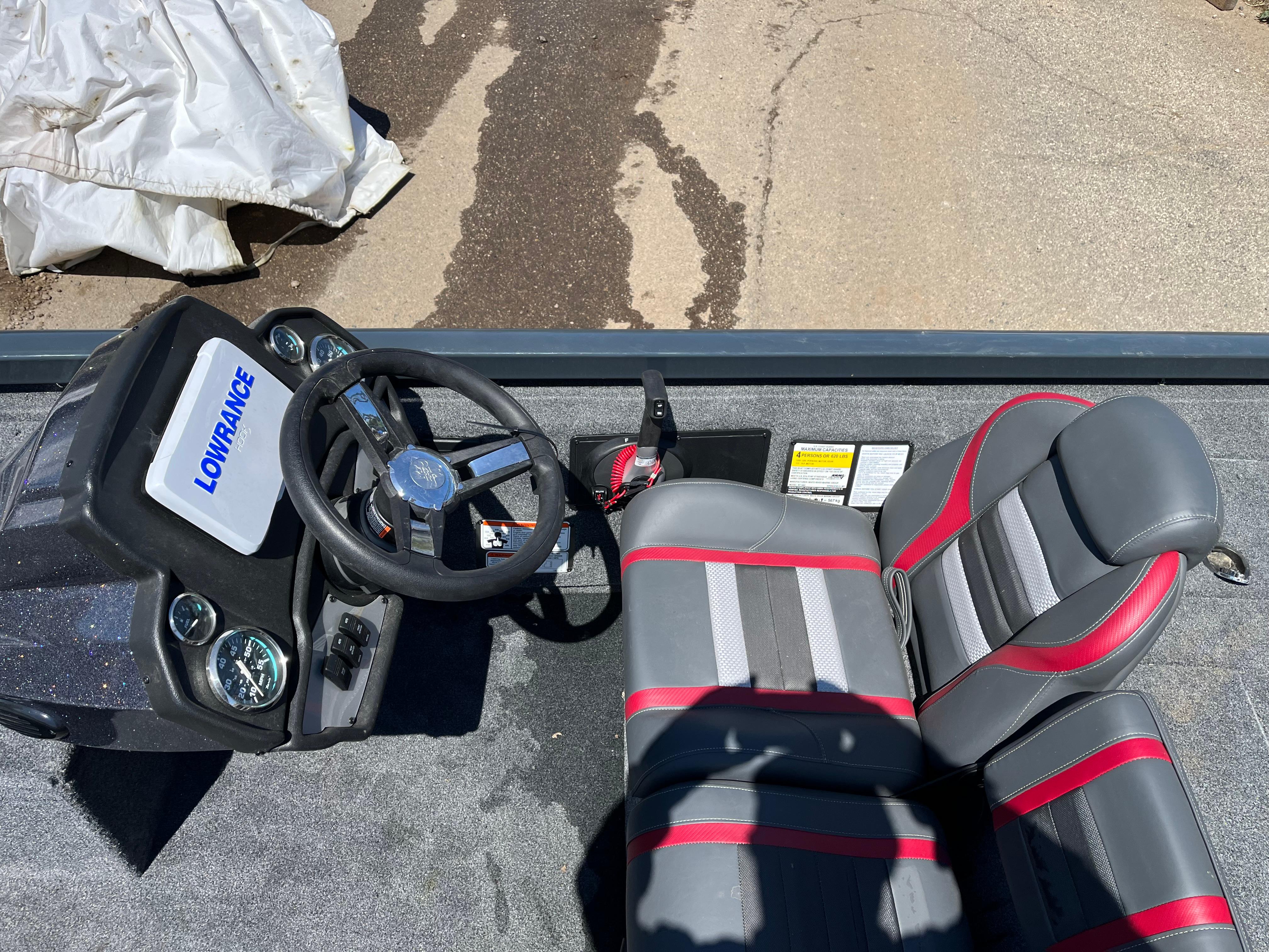 2024 Ranger RT188C boat interior with steering wheel and seats, featuring Lowrance electronics.