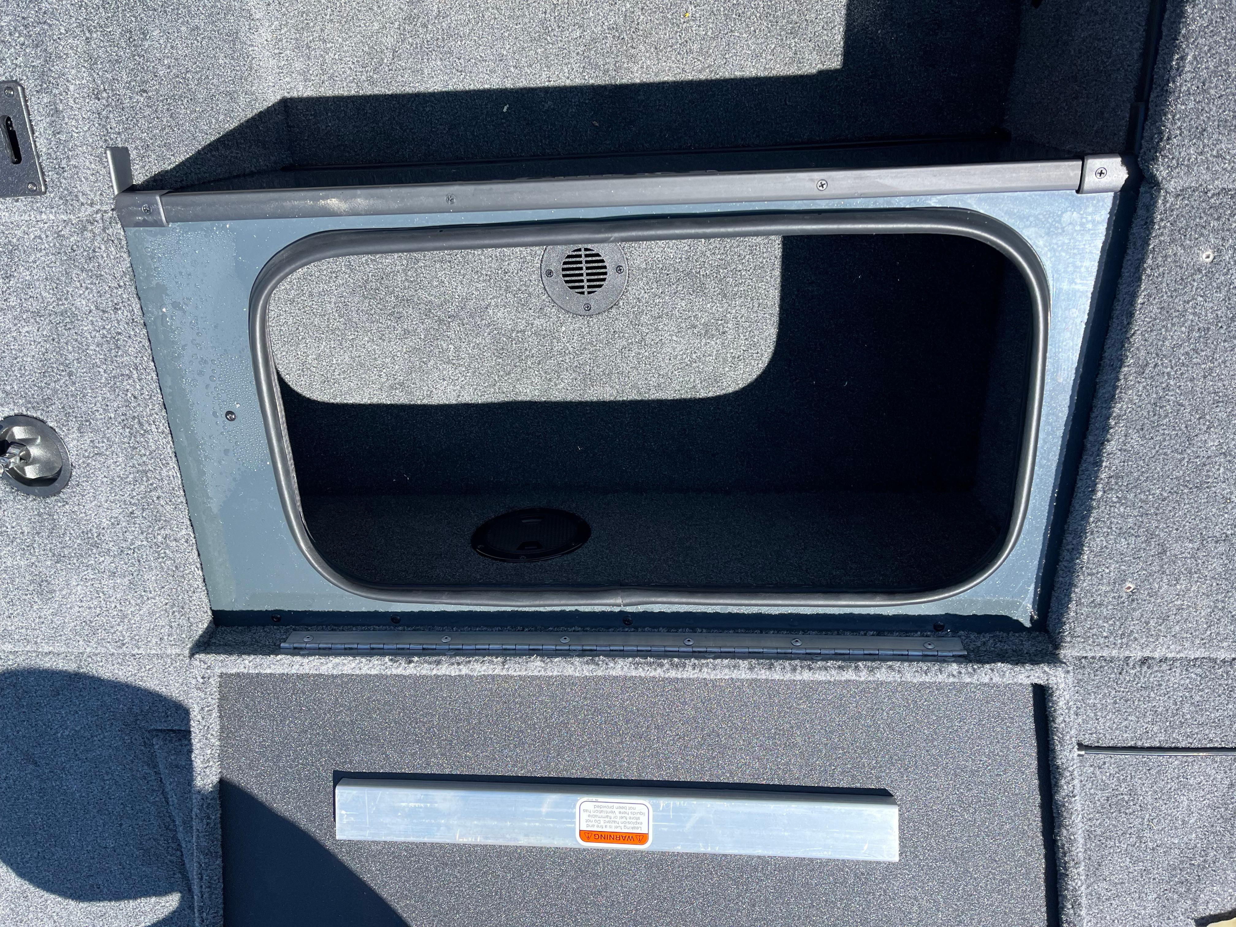 2024 Ranger RT188C boat storage compartment with gray interior and drainage feature.