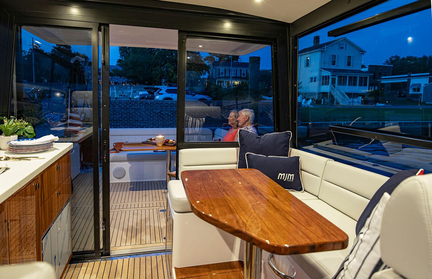 Luxurious interior of 2026 MJM 47R yacht with elegant seating and dining area.