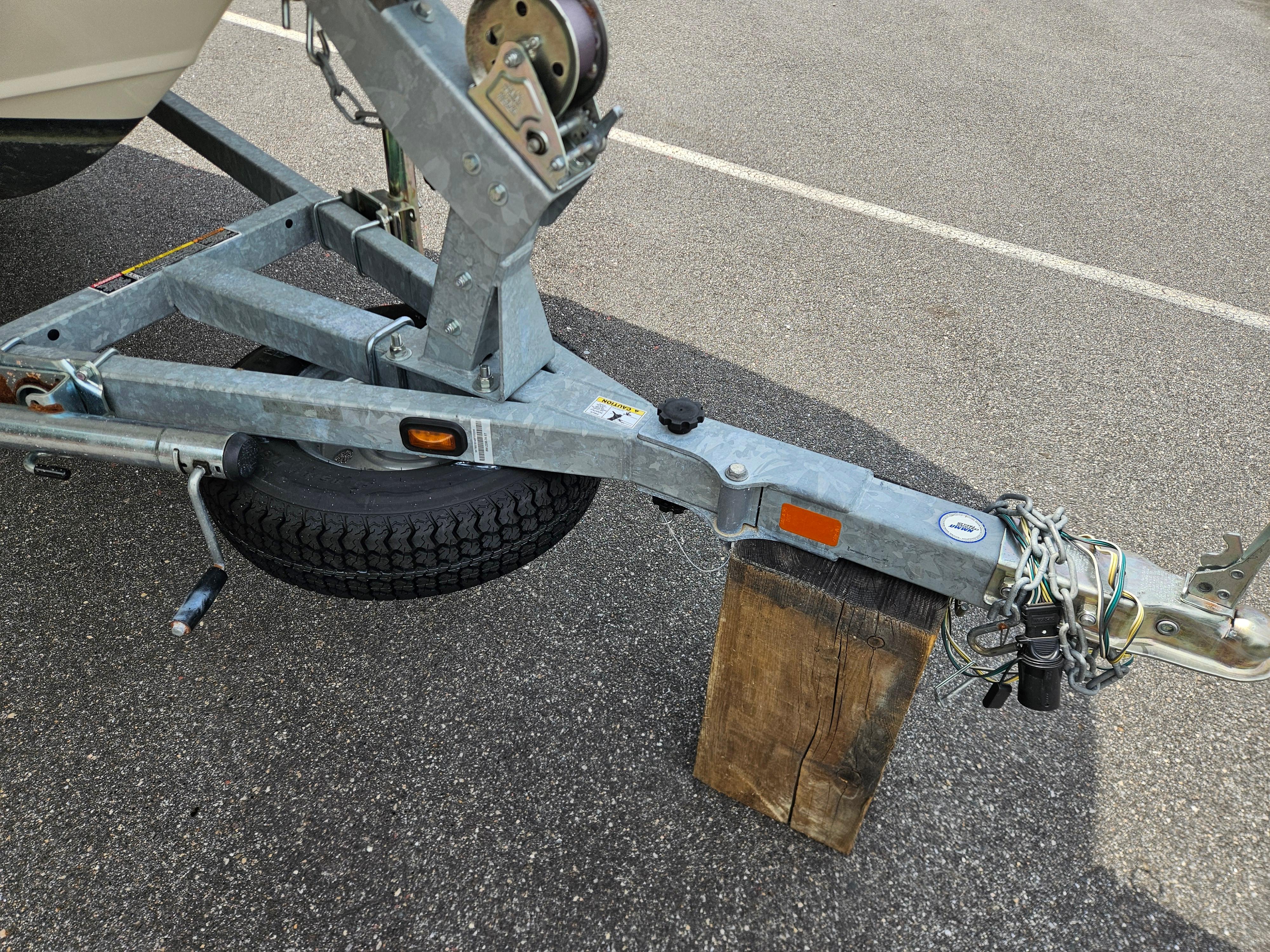 Trailer hitch of a 2008 Boston Whaler 170 Montauk on a wooden block.