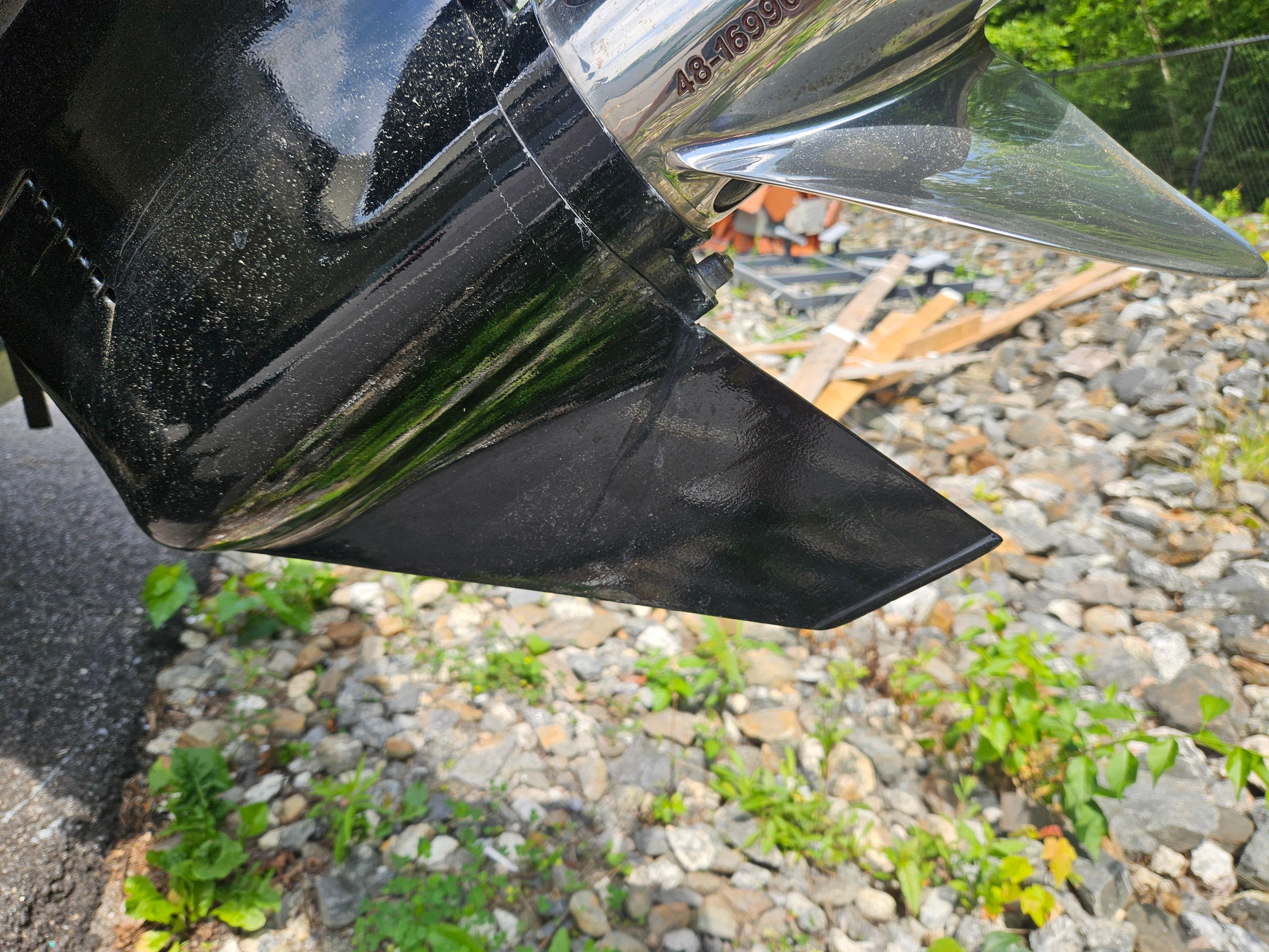 Close-up of a 2008 Boston Whaler 170 Montauk boat propeller outdoors.