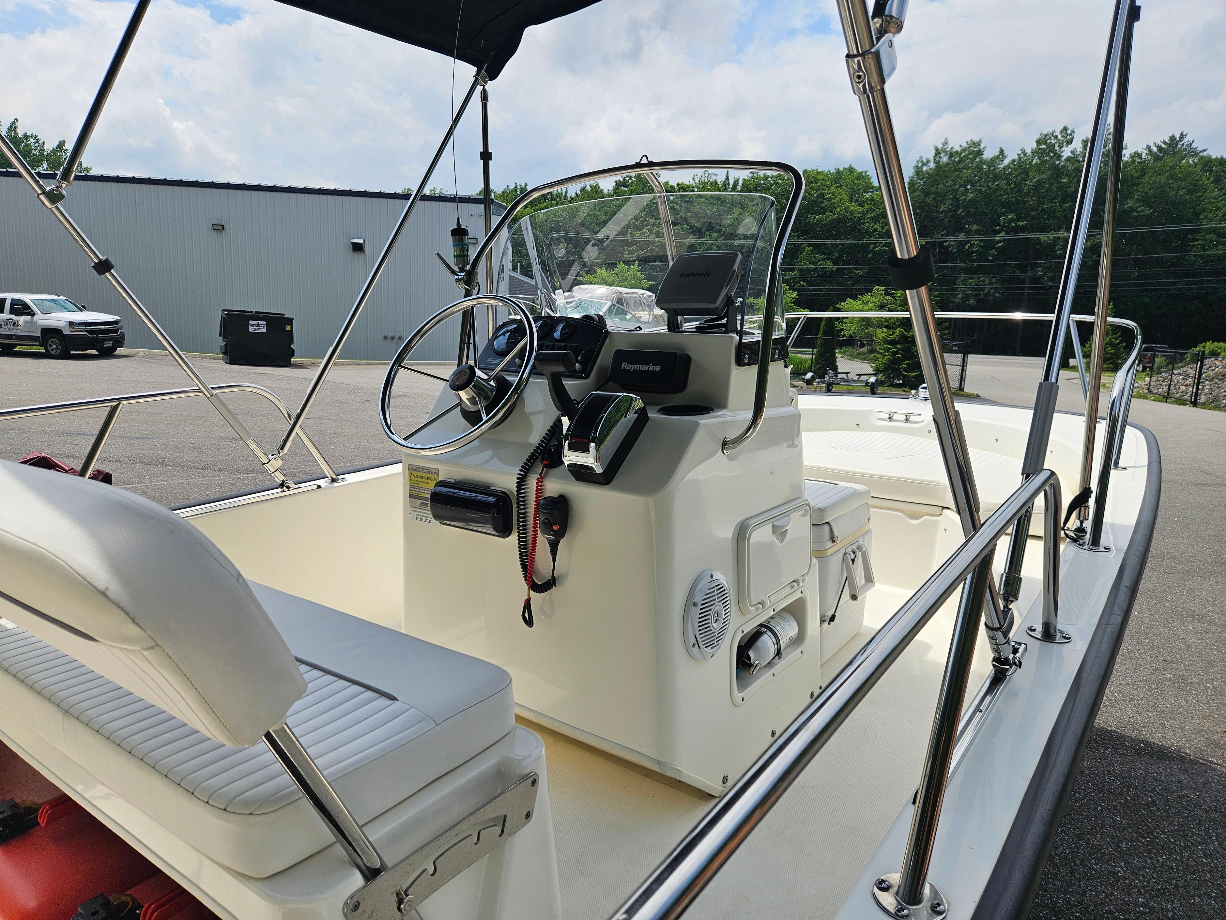 2008 Boston Whaler 170 Montauk boat interior with steering console and seating.