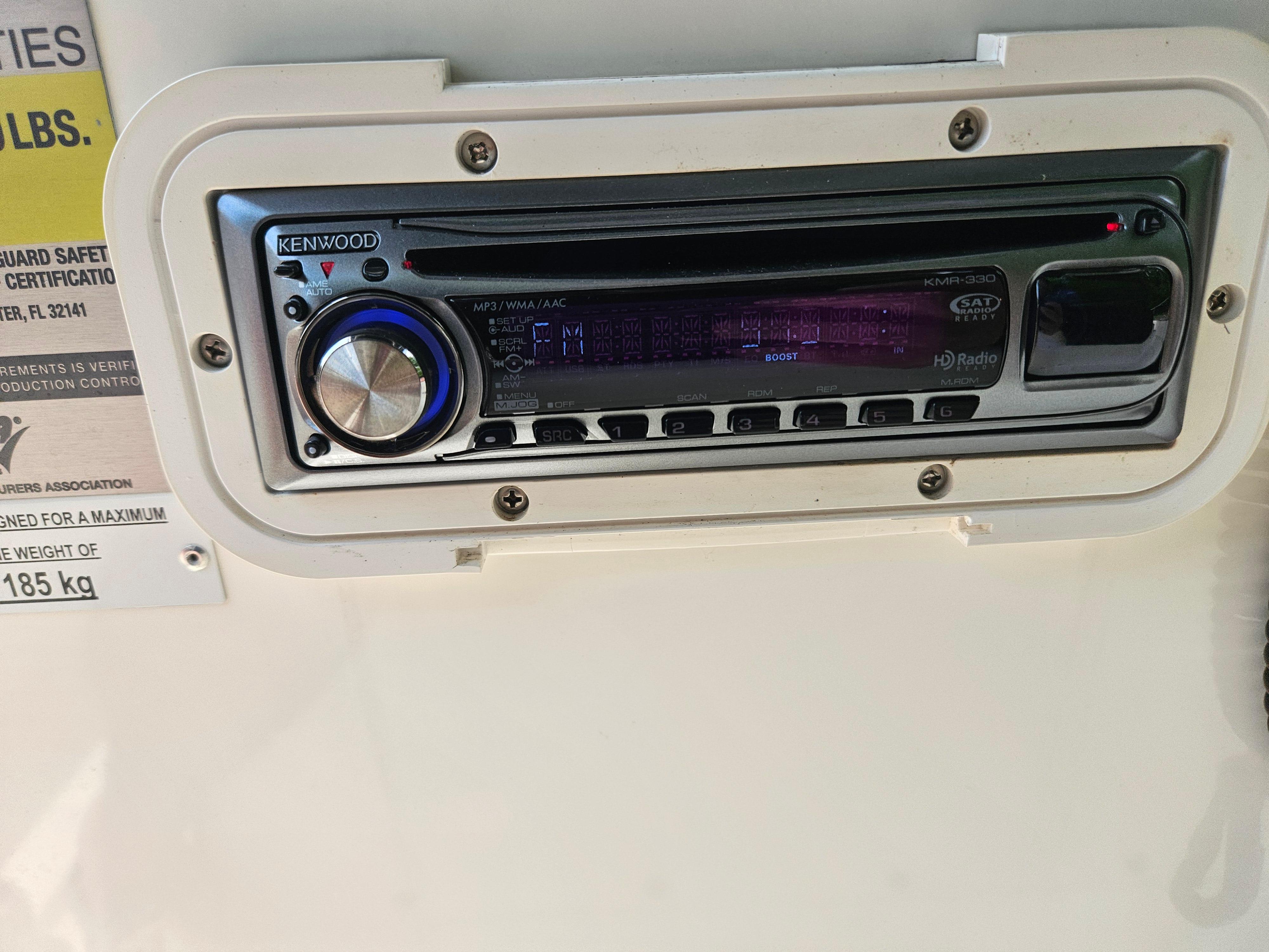 Kenwood stereo system on 2008 Boston Whaler 170 Montauk boat dashboard.