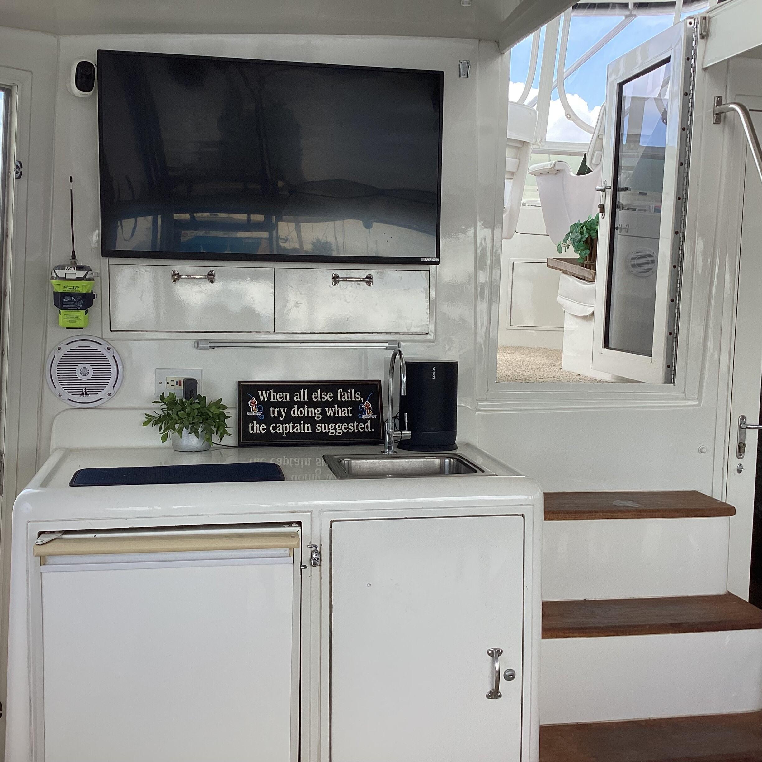 AFT DECK WETBAR W/FRIDGE & FLAT SCREEN SMART TV