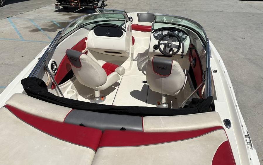 2007 Sea Ray 195 Sport boat interior with red and white seating and steering wheel.