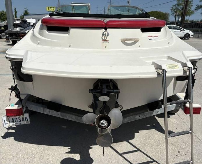 2007 Sea Ray 195 Sport boat on trailer, rear view with propeller and ladder.