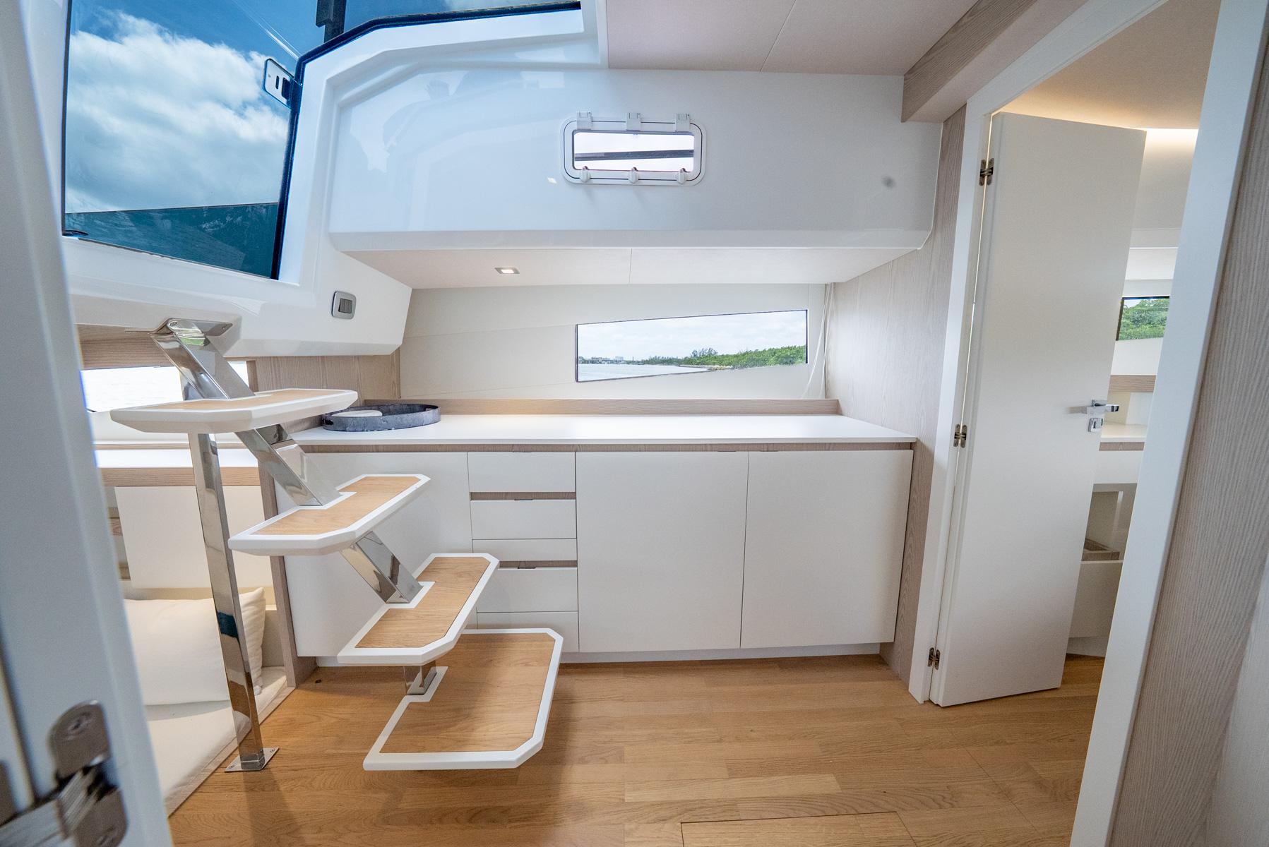Fiart-39 Seawalker 2024-STRADE BLU FL-US-2024 Fiart 39 Seawalker interior with modern white cabinetry and wooden flooring.-9758537 | Thumbnail