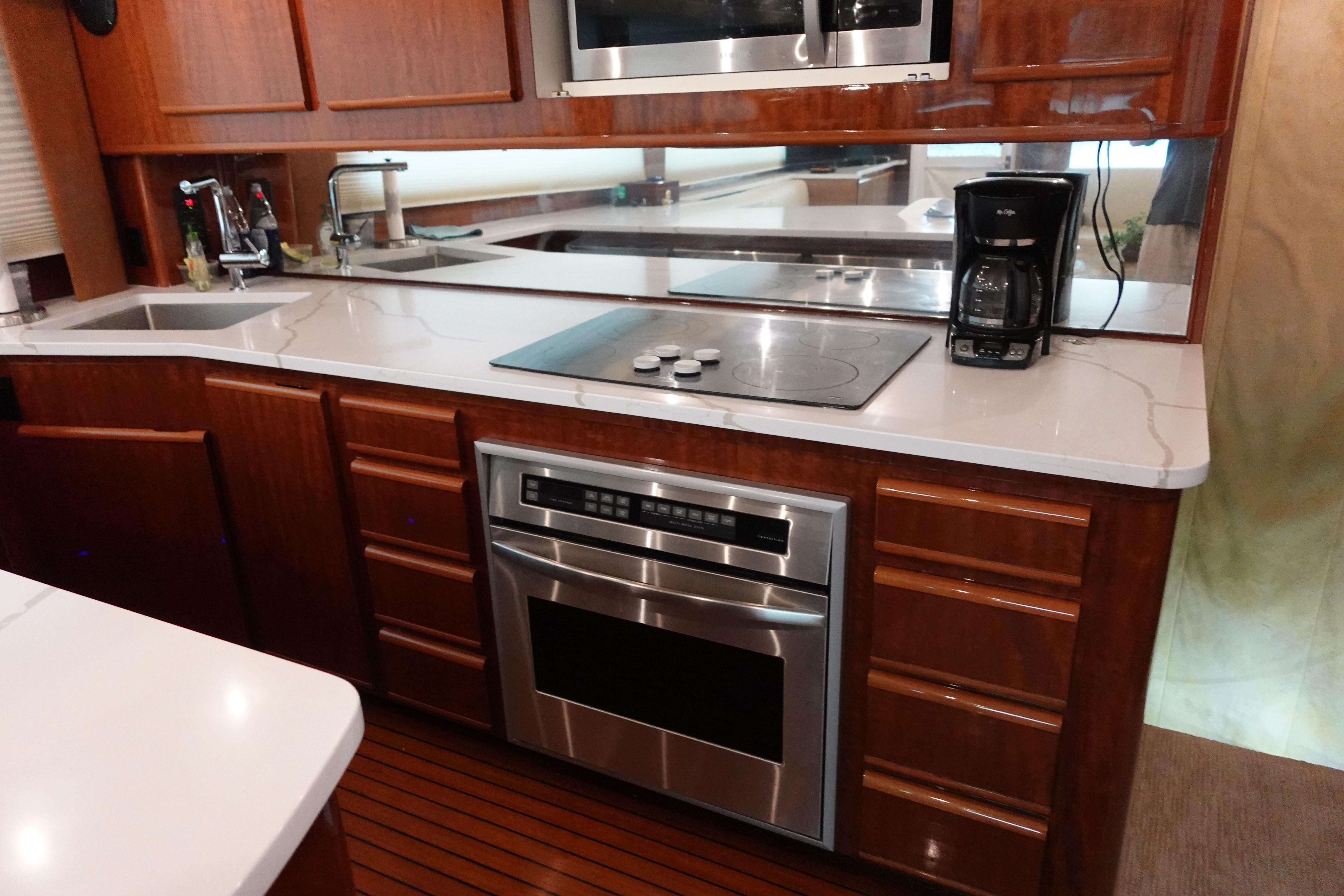 Donzi-Z-65 Tounament Fisherman 1988 -NY-US-1988 Donzi Z-65 Tournament Fisherman yacht kitchen with modern appliances and wooden cabinetry.-9438541 | Thumbnail