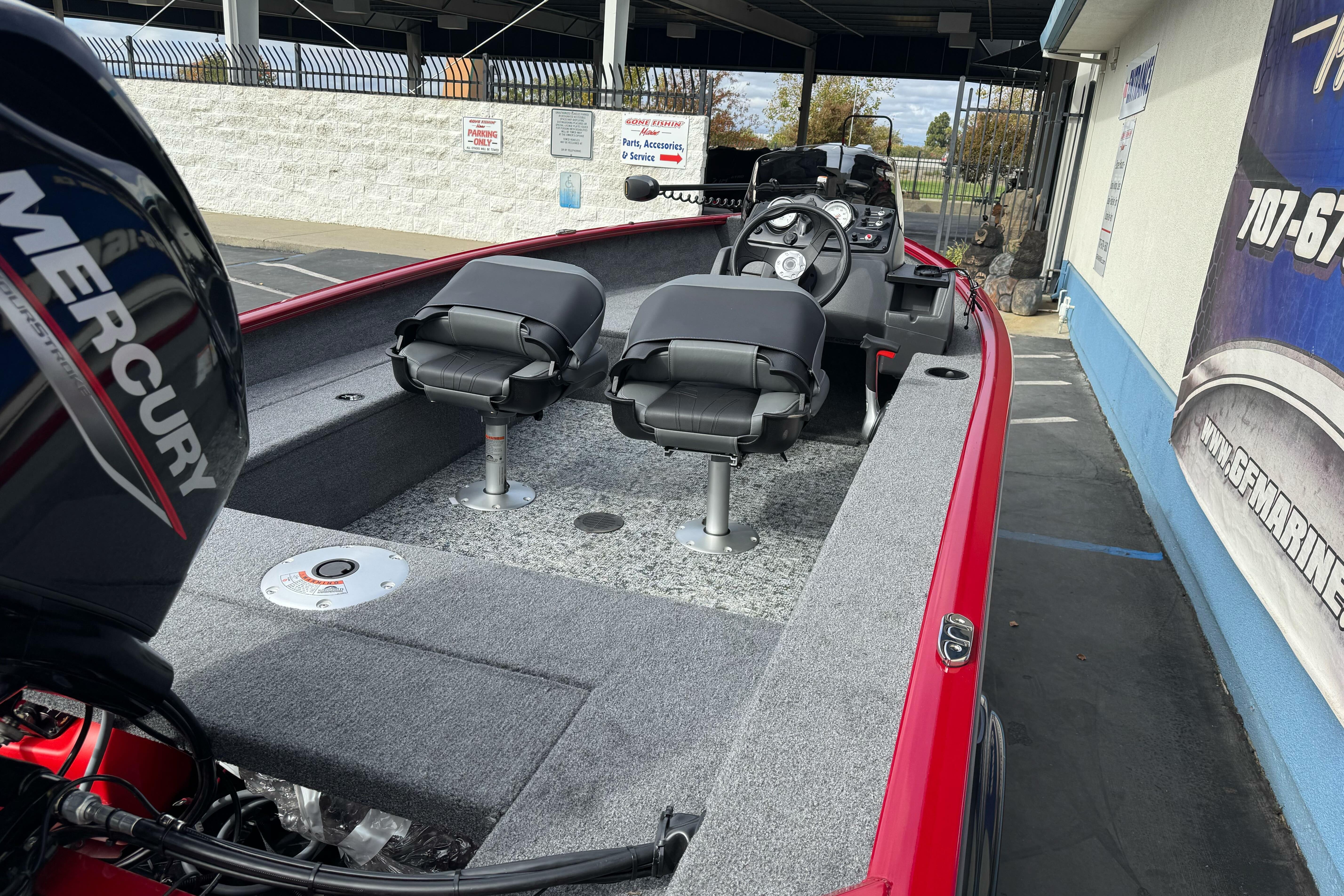 2026 Tracker Super Guide V-16 SC boat with Mercury engine, featuring dual seats and steering console.