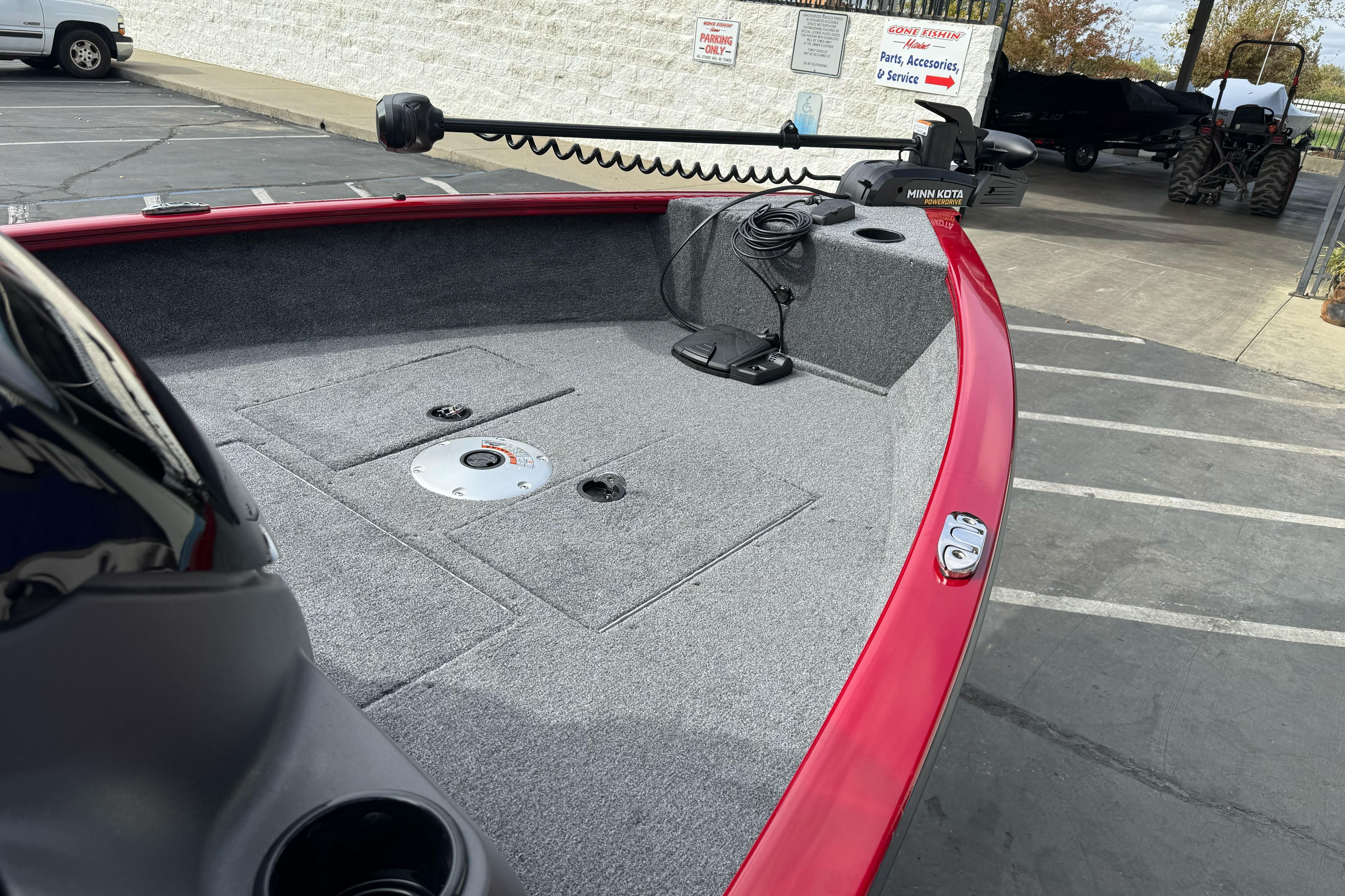 2026 Tracker Super Guide V-16 SC boat with red trim and Minn Kota trolling motor.