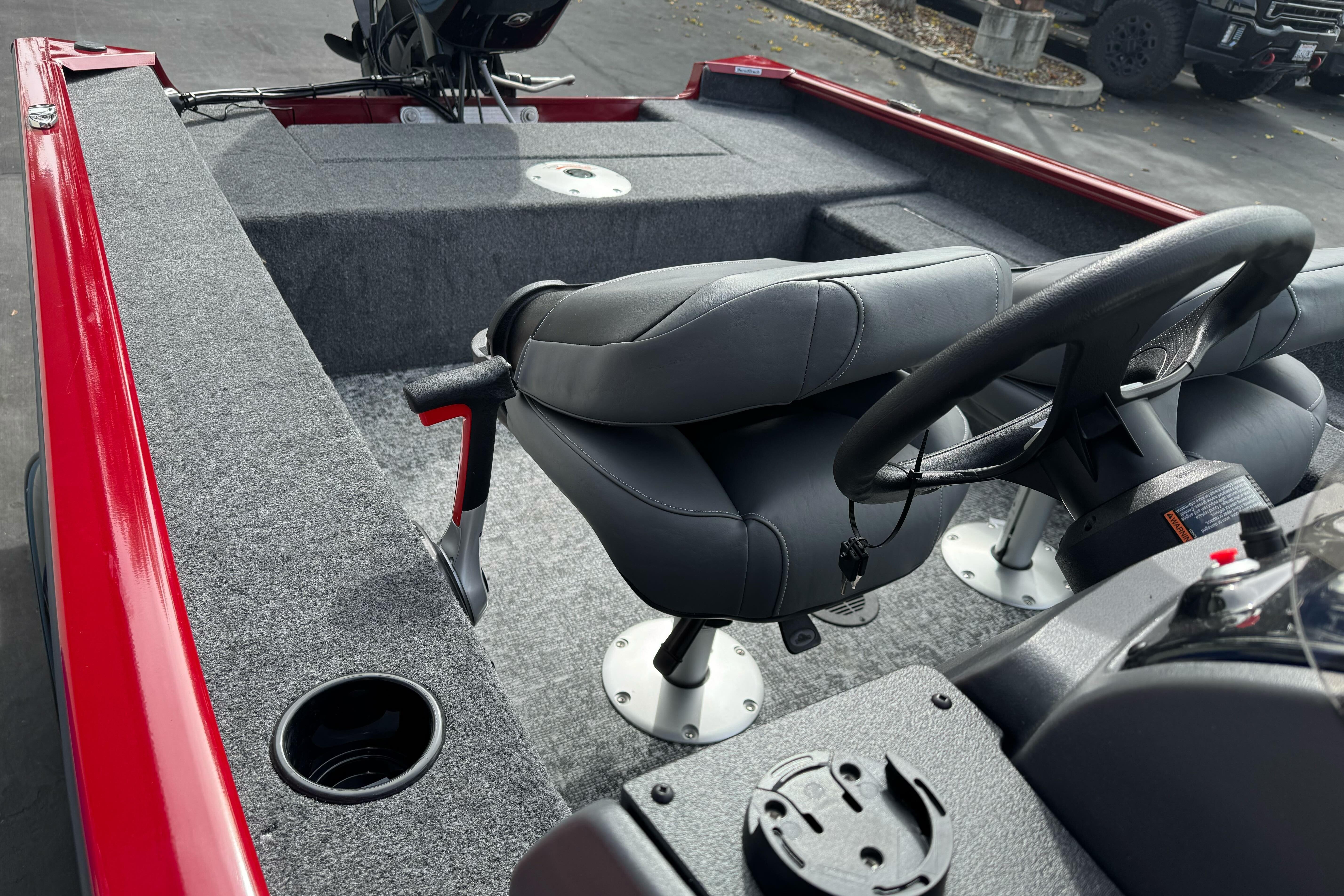 2026 Tracker Super Guide V-16 SC boat interior with steering wheel and seating.