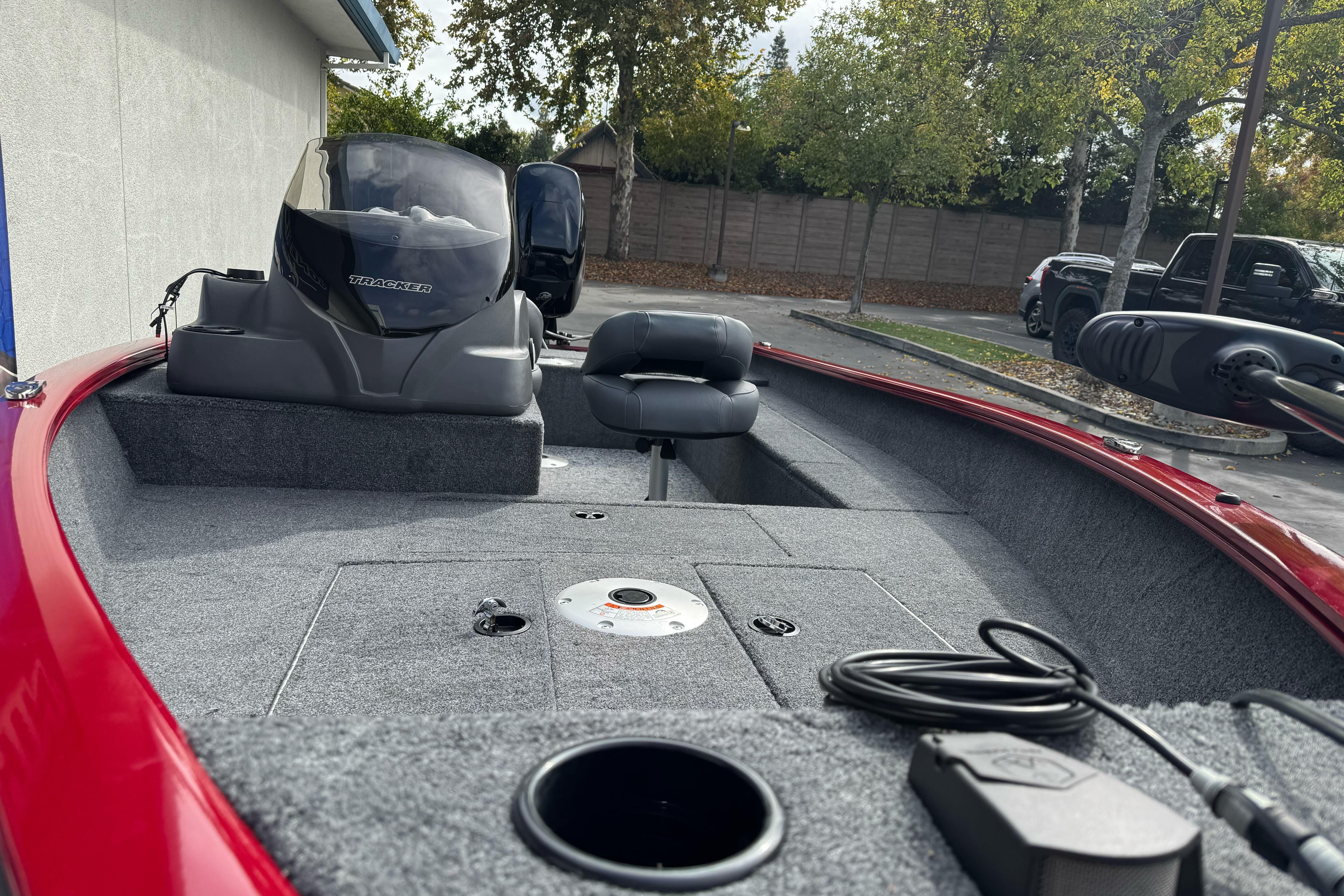 2026 Tracker Super Guide V-16 SC boat interior with steering console and seating.