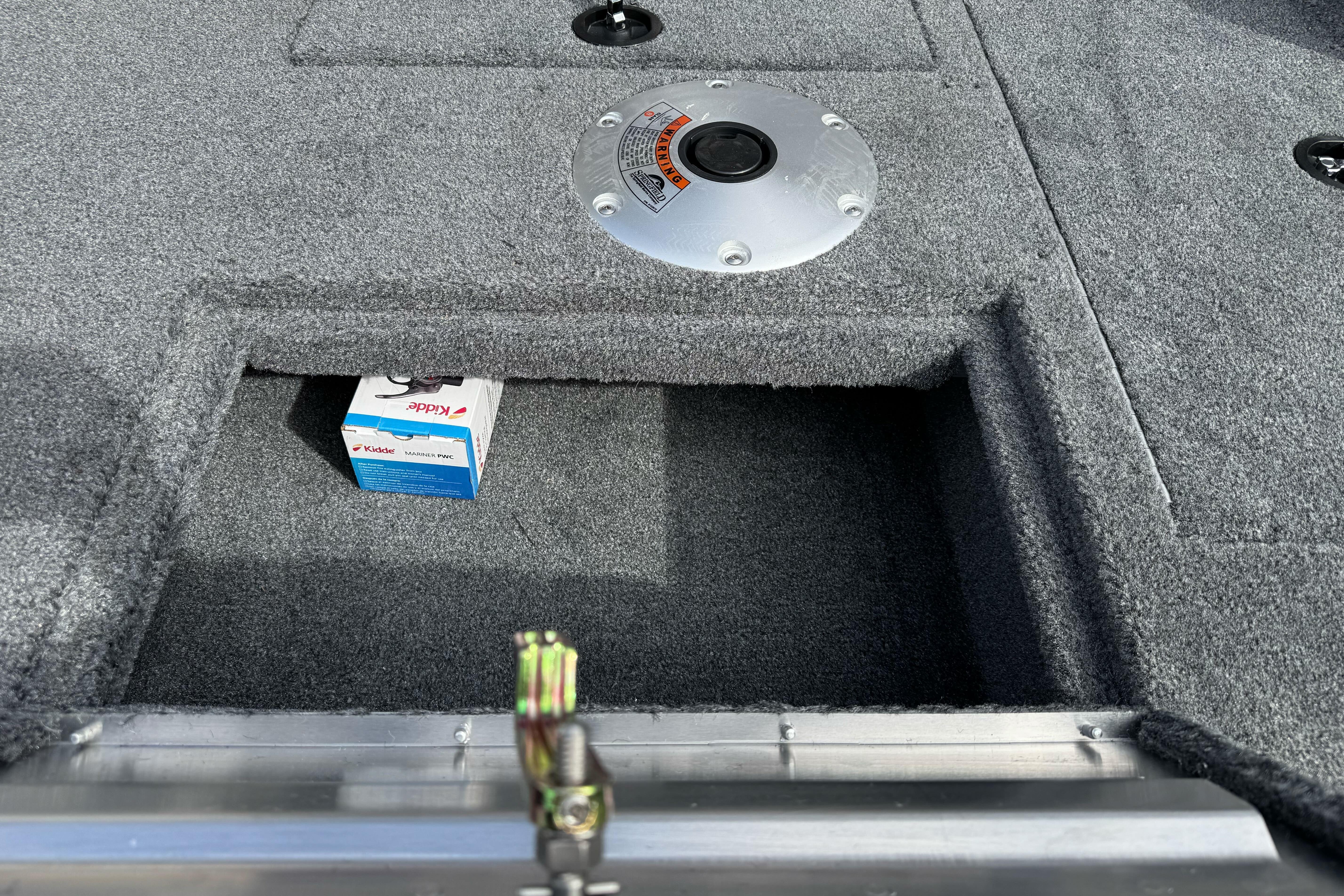 2026 Tracker Super Guide V-16 SC boat interior with storage compartment and Kidde box.