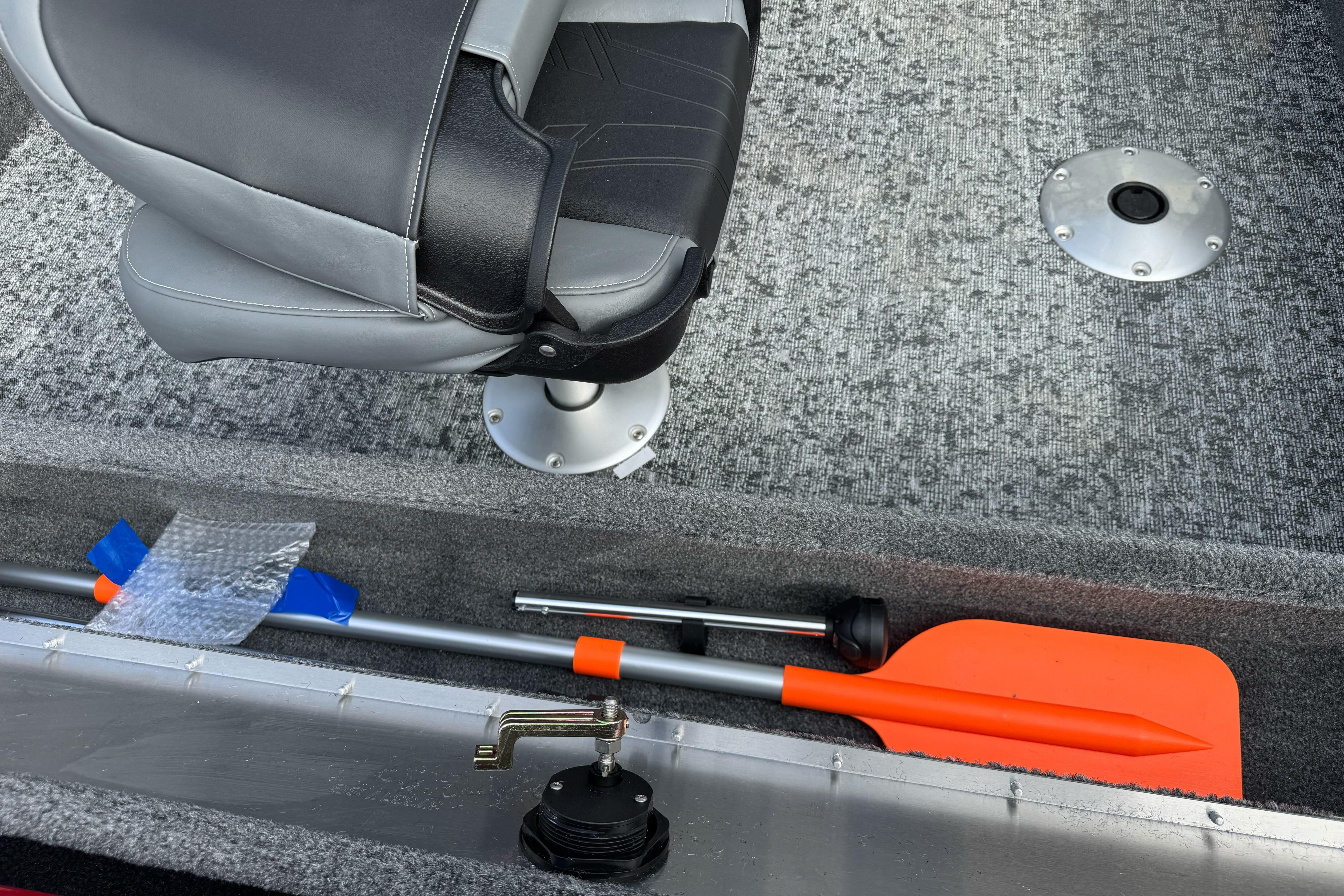 2026 Tracker Super Guide V-16 SC boat interior with seat and storage compartment.