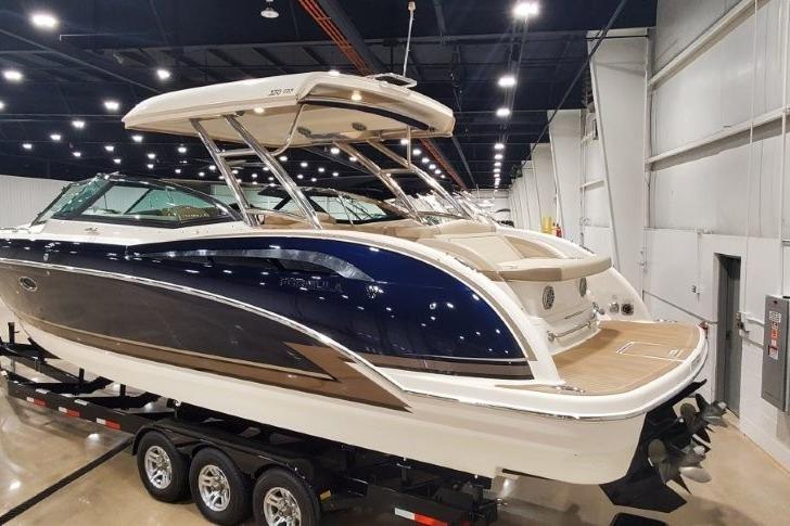2017 Formula 350 Crossover Bowrider on trailer in indoor showroom.