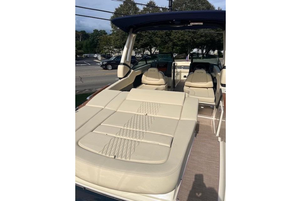 2026 Chris-Craft Sportster 28 boat interior with beige seating and modern design.