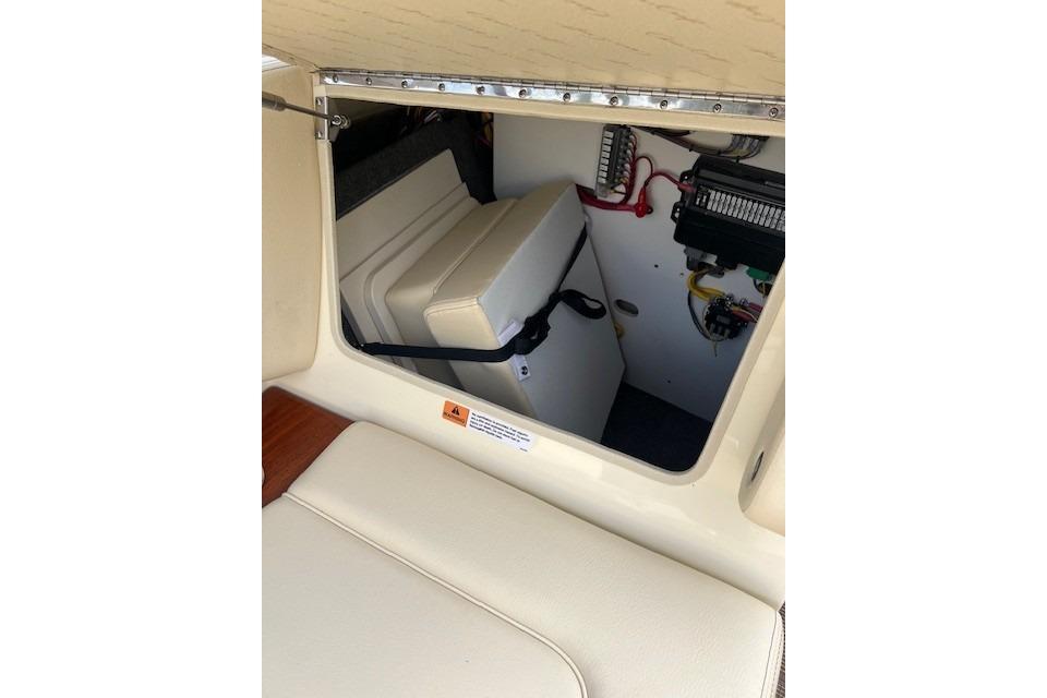2026 Chris-Craft Sportster 28 interior storage compartment with electrical components.