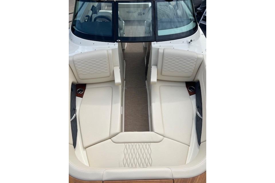 2026 Chris-Craft Sportster 28 boat interior with luxurious cream seating and elegant design.